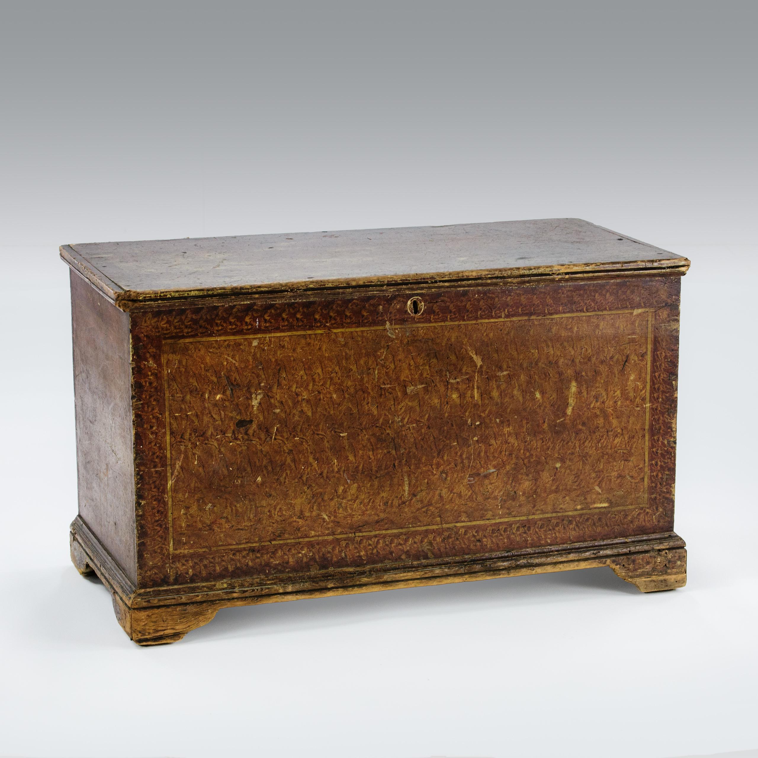 
Impressive American Folk Art Chest. Original untouched worn Scumble Painted finish. The most impressive, understated repeat pattern Burl Wood finish. Faux trompe d'oiel Panels. Authentic wear to the feet and corners of the lid. The reverse painted