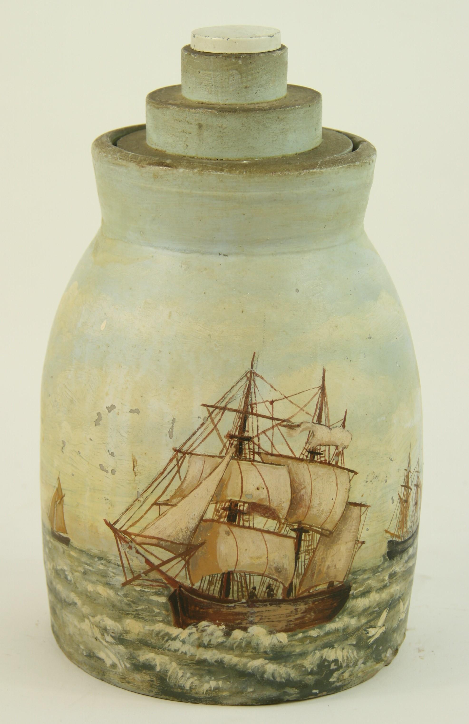 3-441 Folk Art maritime ships paintings on a crock pot with wood lid.
At one point converted to a lamp then undone.