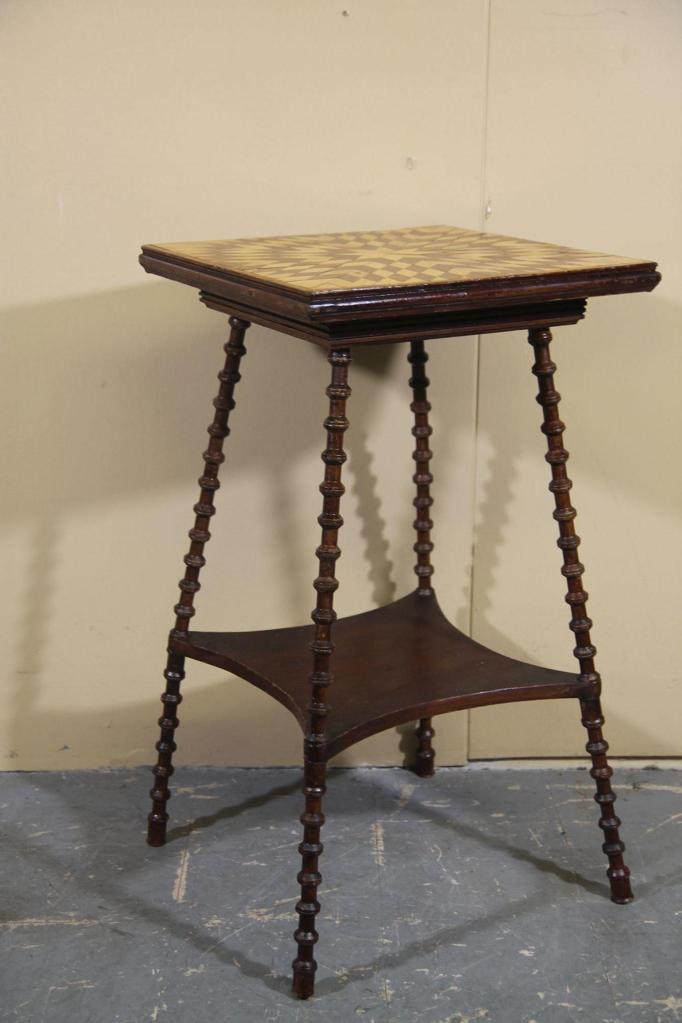 Pleased to offer this great 1940's folk art side table. Legs are vintage thread spools with metal rod running through them for strength. Top is this nice inlay wood pattern.