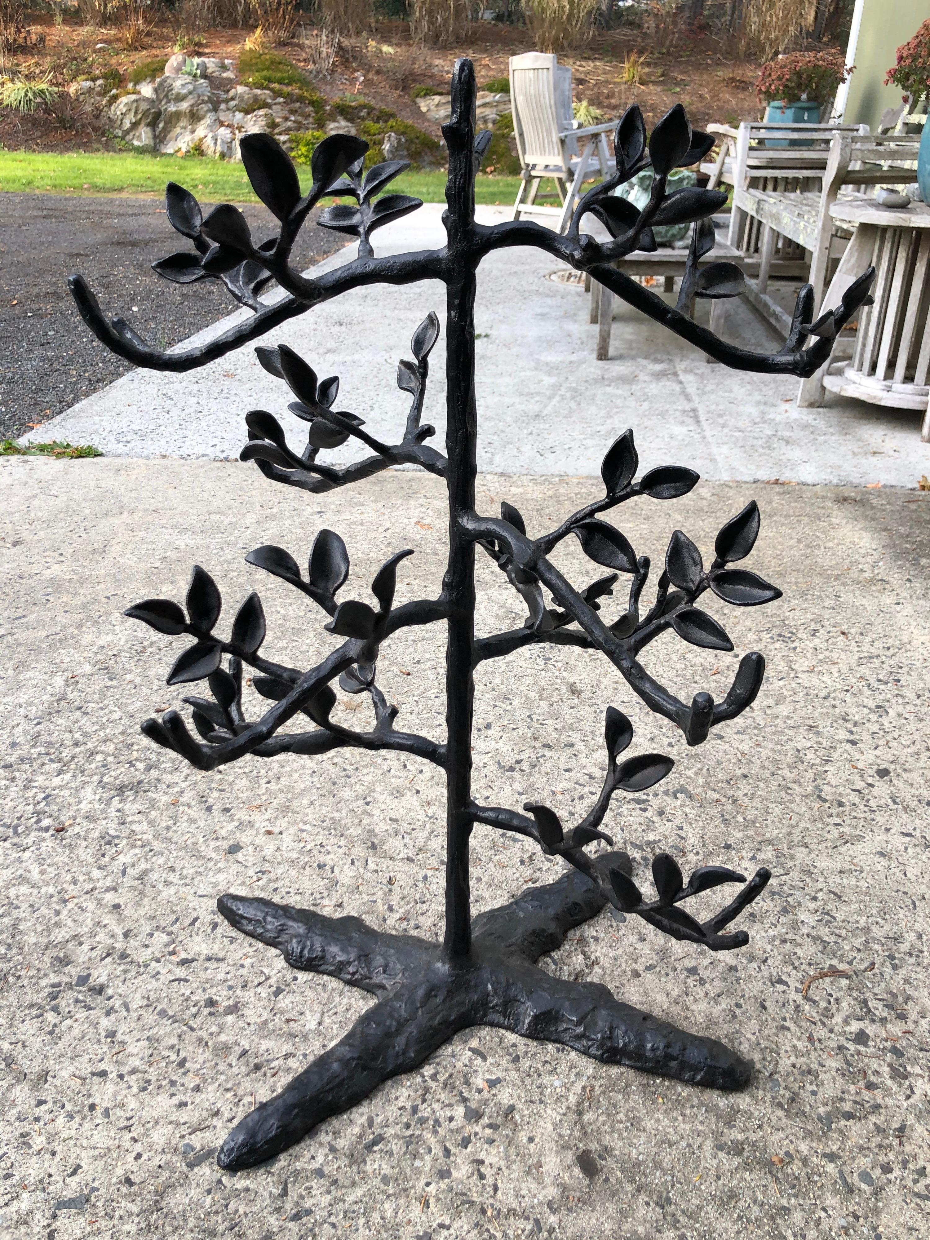 Large table top black metal 6 bottle wine holder in the shape of a tree. Perfect as a centerpiece for a party. Also a great piece to display jewelry. Especially if you do jewelry shows. Heavy and stable design with super wide four footed cross base
