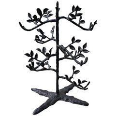 Large table top black metal 6 bottle wine holder in the shape of a tree.