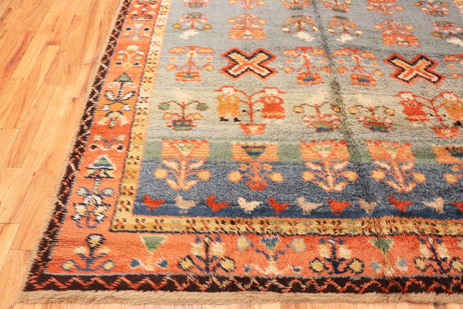 Vintage Folk Art Shag rug, country of origin: Germany, circa mid-20th century. Size: 7 ft 10 in x 11 ft (2.39 m x 3.35 m)

Vivid coloring, striking artistry, and breathtaking traditional motifs define this stunning German antique rug. Boasting a