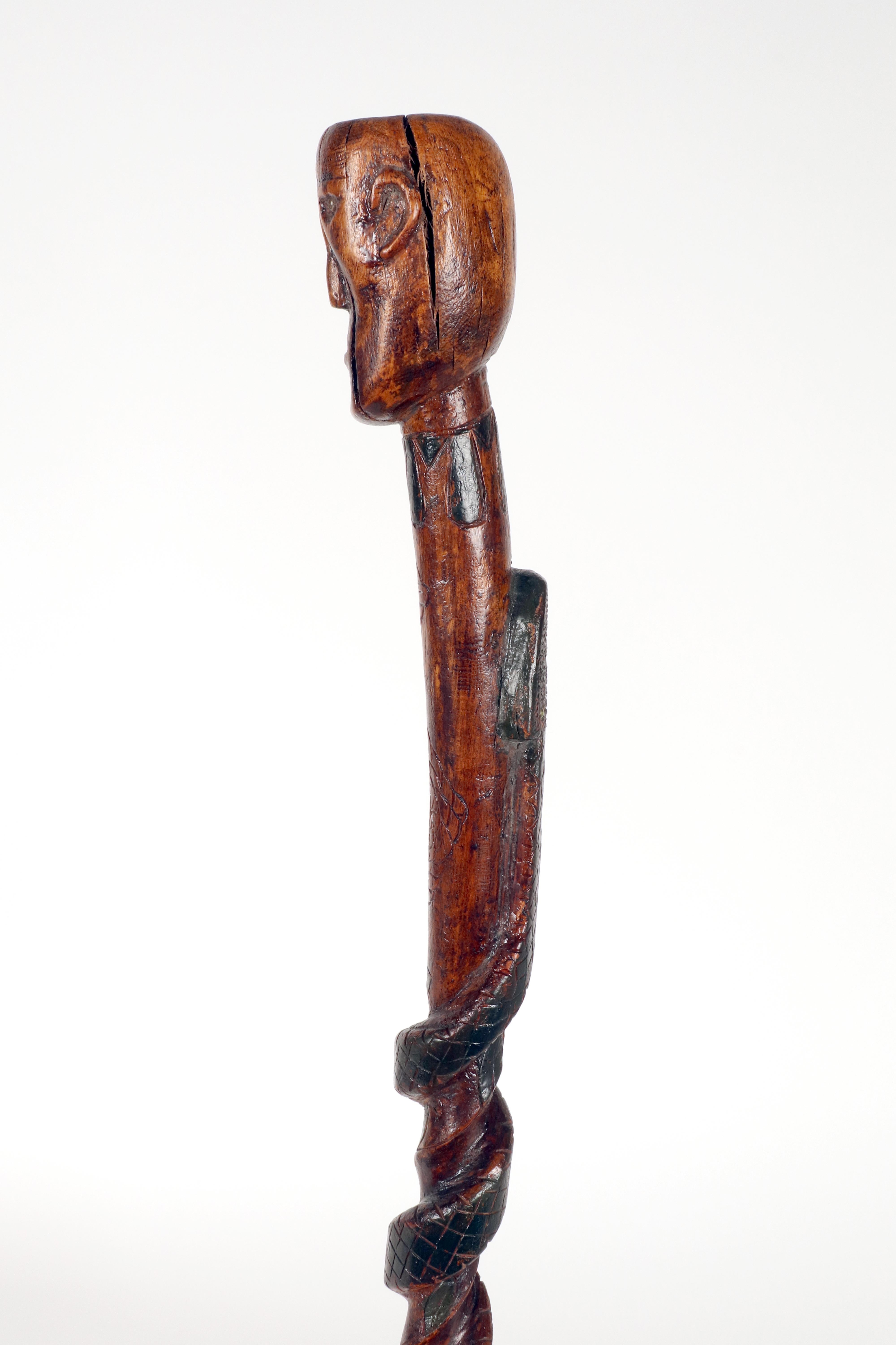 19th Century Folk art walking stick depicting a man with a snake. USA circa 1870. For Sale