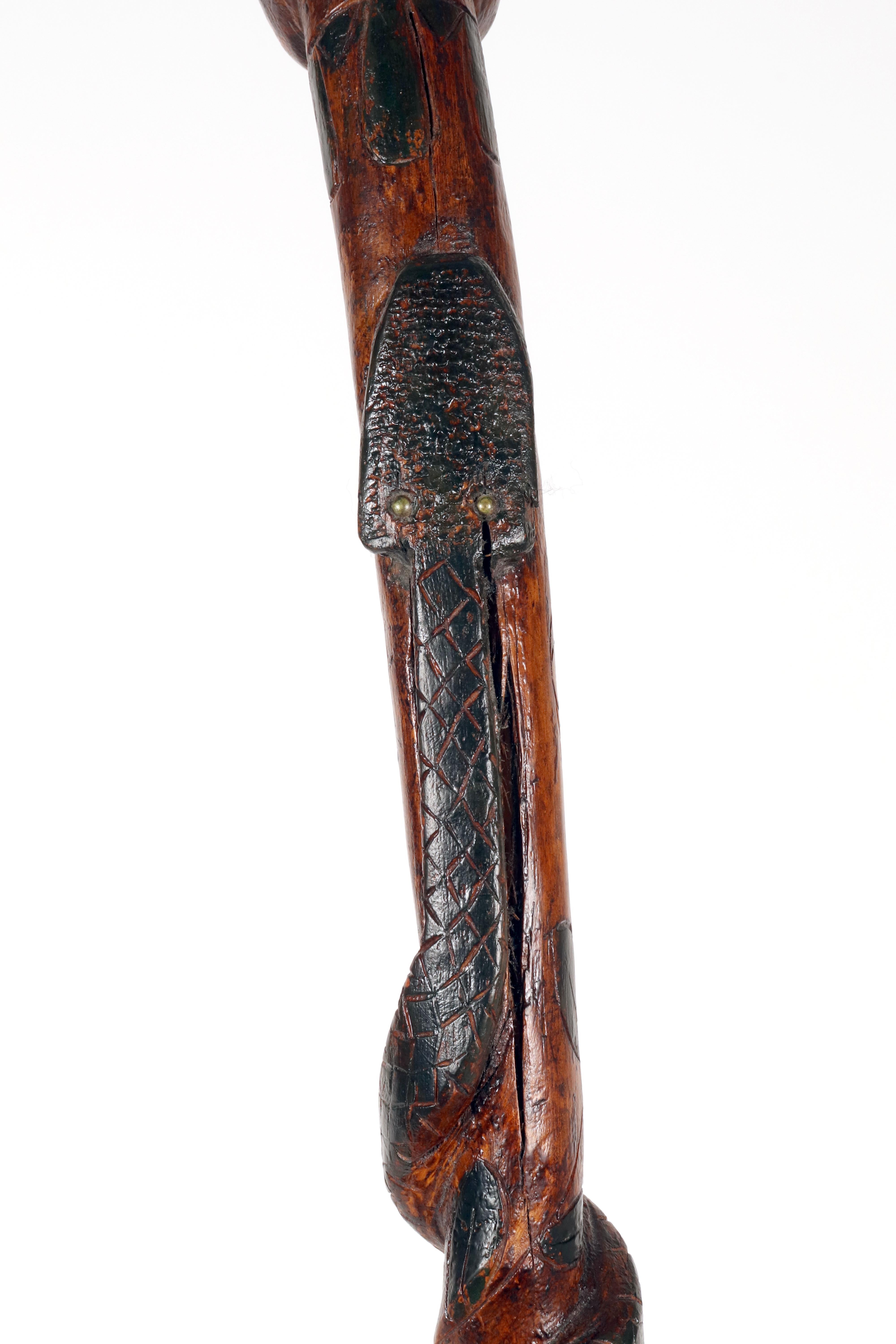 Folk art walking stick depicting a man with a snake. USA circa 1870. For Sale 1