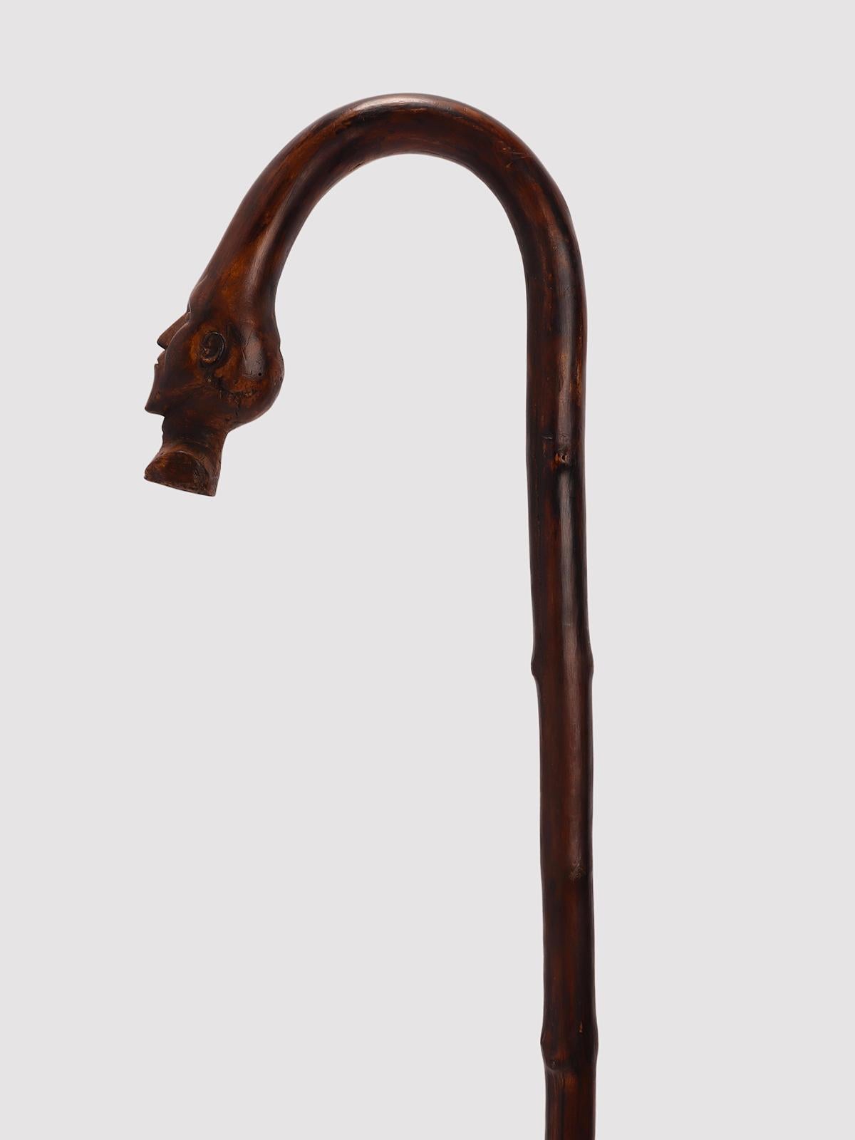Folk art walking stick: one piece of fruitwood depicting the head of a man. United States of America circa 1880.