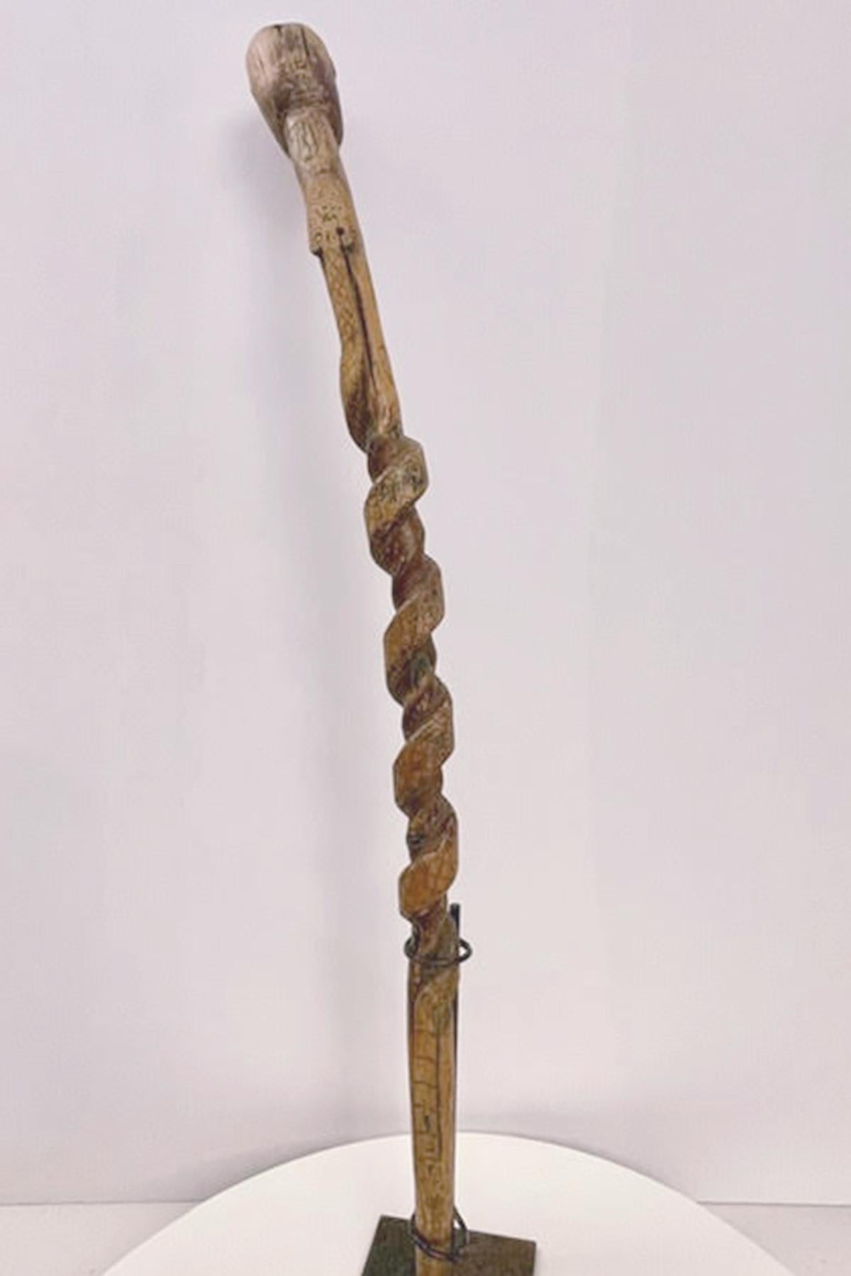 American Folk art  walking stick depicting thehead of a man with a snake, USA 1880. For Sale