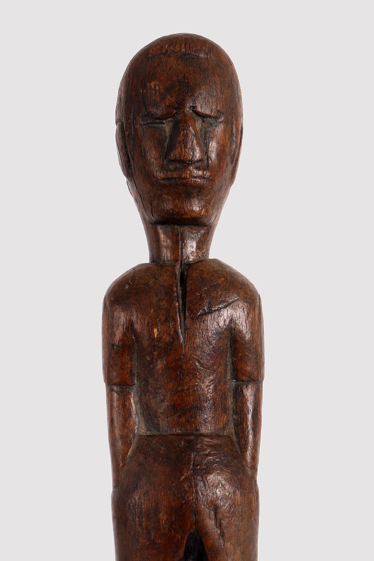 Fruit wood sculpture, Folk Art, depicting a man standing with his hands in his pockets. United States, second half of the 19th century.