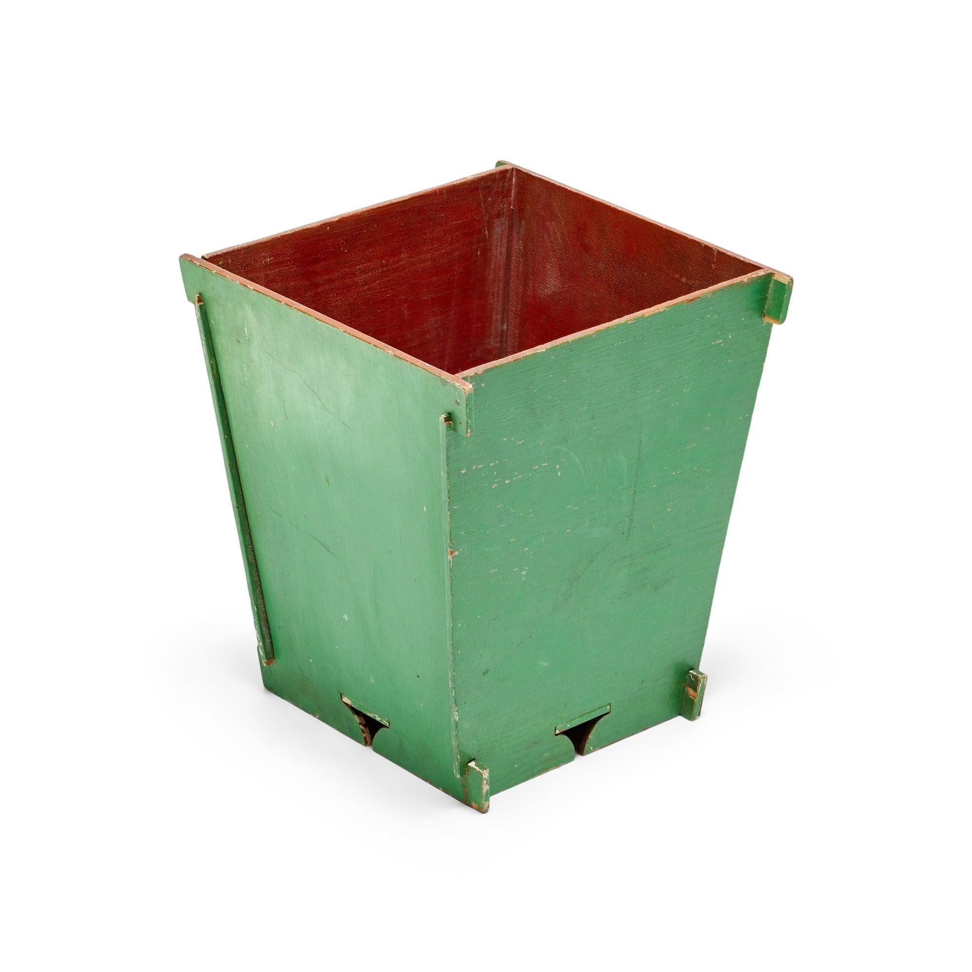 Green and Red-Orange painted planter box or trash can.