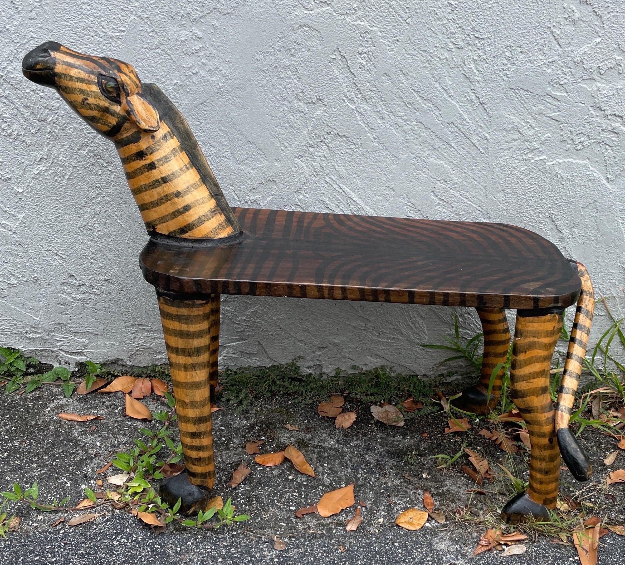 Folk Art carved & hand painted Zebra bench with glass eyes.