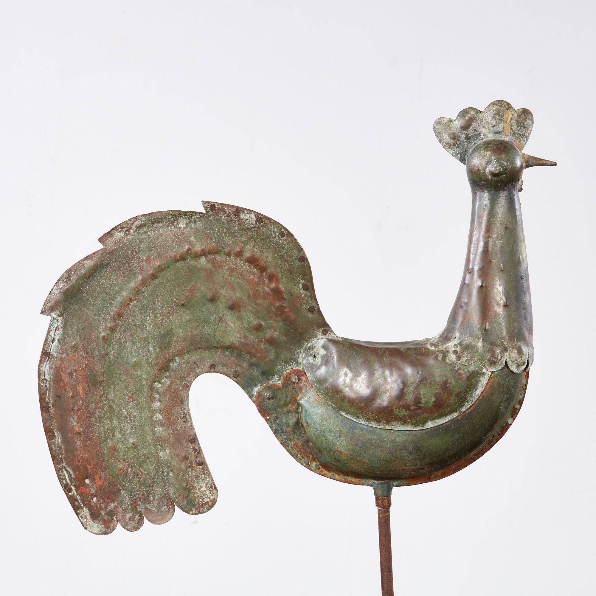 A 19th century French full-bodied copper rooster weathervane with a charming, stylized form and wonderful naturally patinated verdigris surface.  Now on a high quality four sided pyramidal stand. 