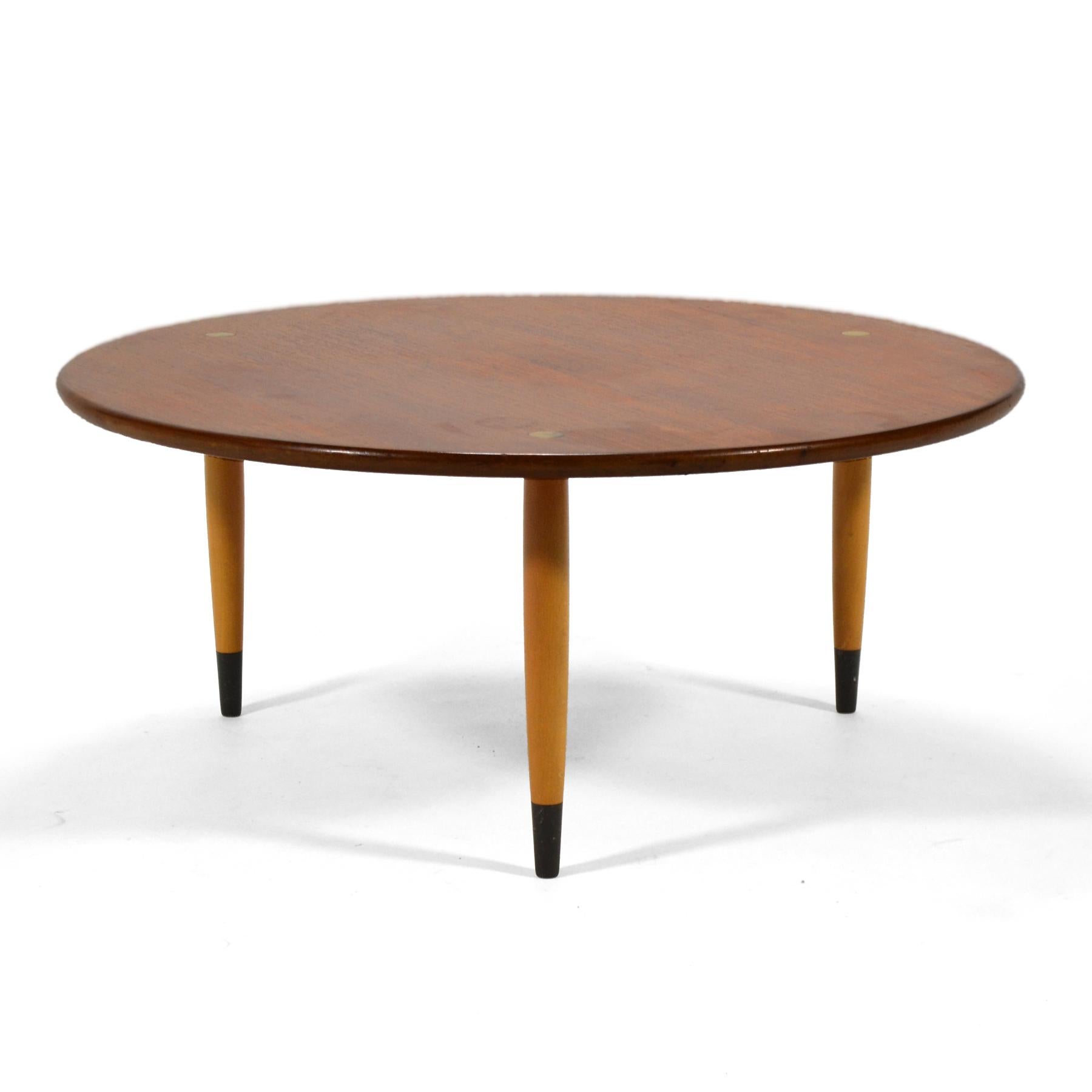 A lightly scaled and nicely detailed coffee table in teak and birch with brass fittings, this design by Folke Ohlsson is easy to live with.
 