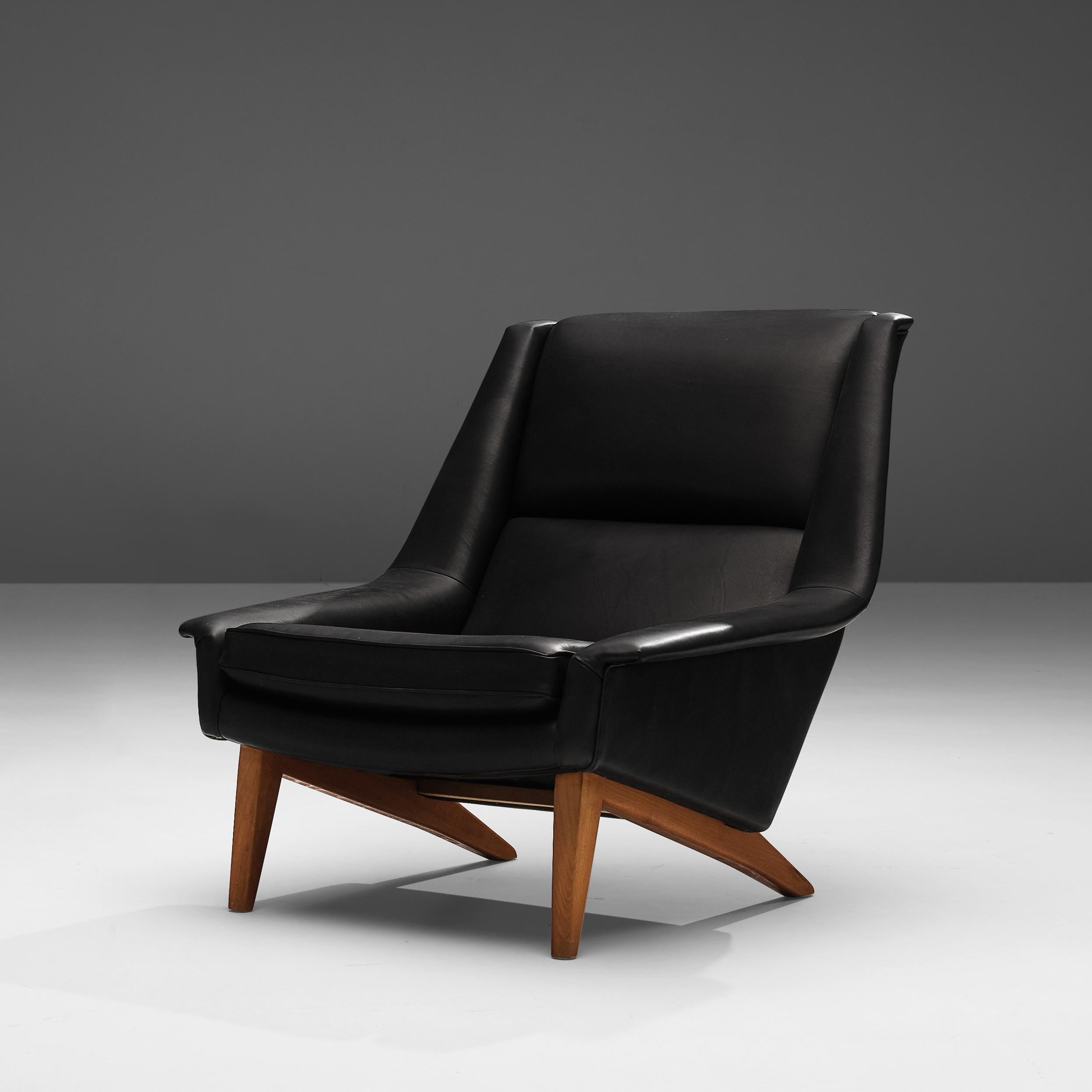 Folke Ohlsson for Fritz Hansen, lounge chair', in any preferred leather of fabric, teak, Denmark, designed in 1957 

This high quality made lounge chair is made to reach an ultimate level of comfort as can clearly be recognized in the design.