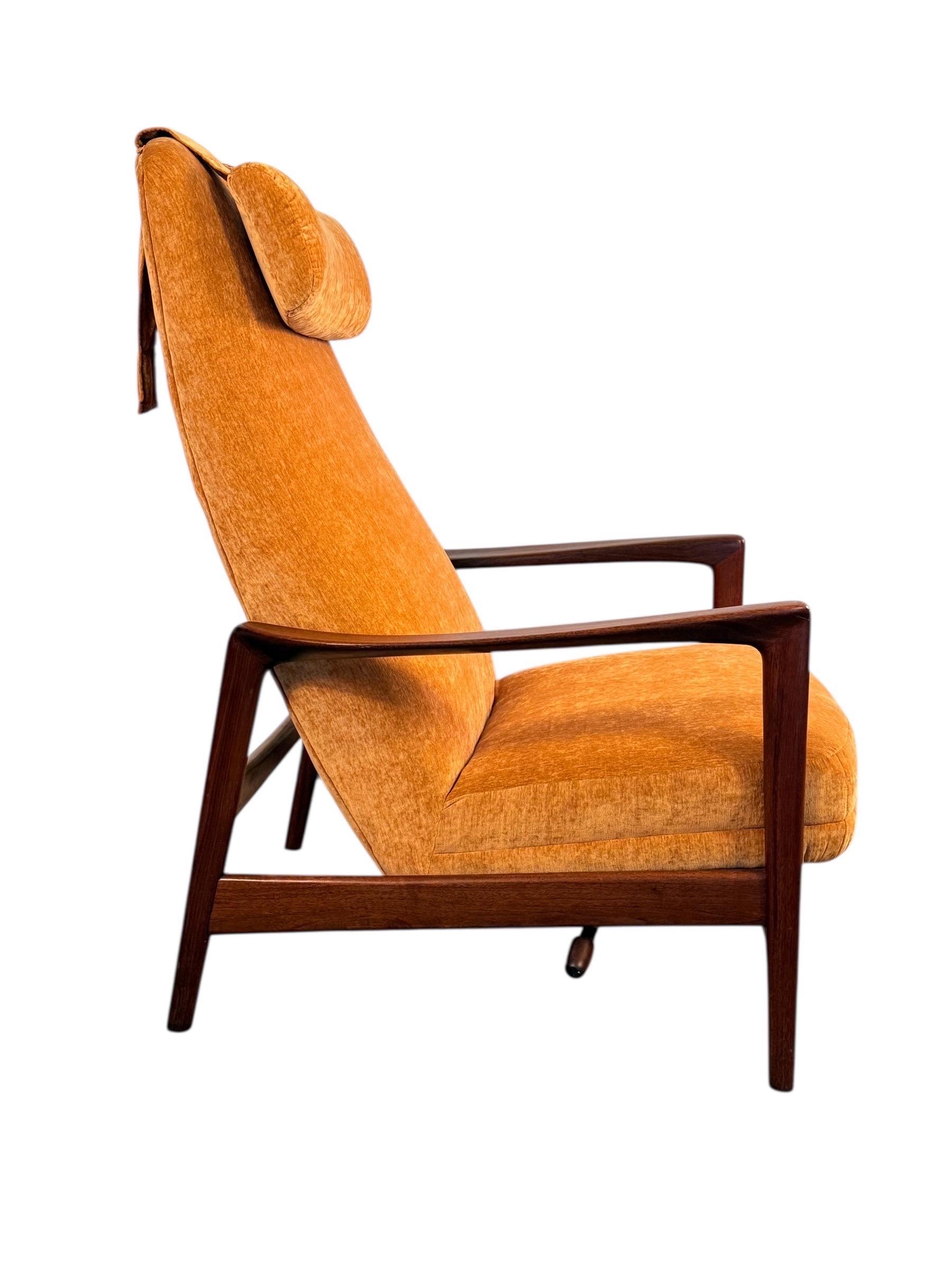 A standout example of mid-century Scandinavian design, this high-back lounge chair and matching ottoman were designed by Folke Ohlsson for DUX of Sweden, c. 1960s. Known for his ability to blend comfort with clean-lined sophistication, Ohlsson