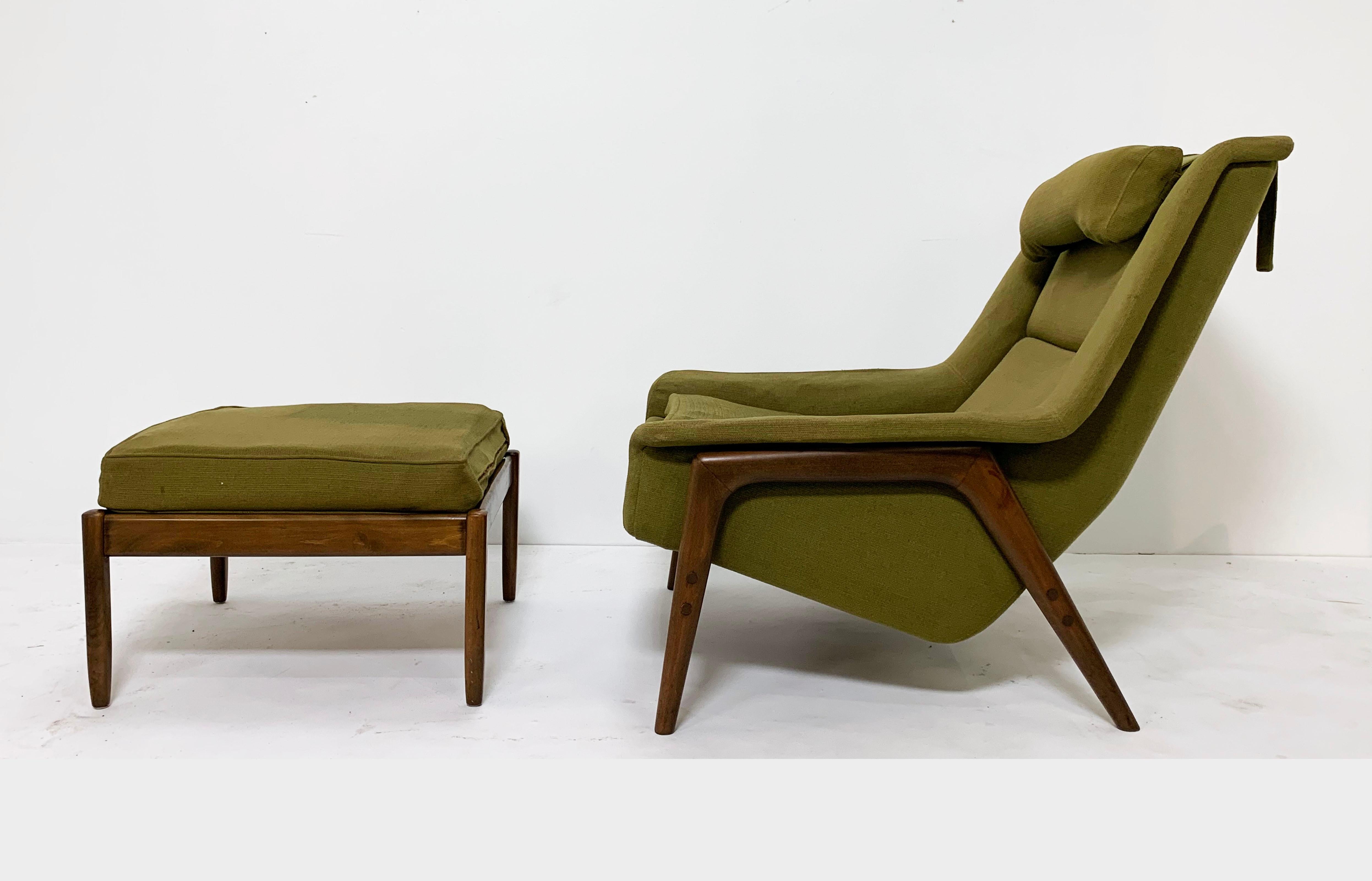 Handsome Danish modern lounge chair with sculptural birch frame legs and flared arms, and matching ottoman. 

Chair measures 33.5