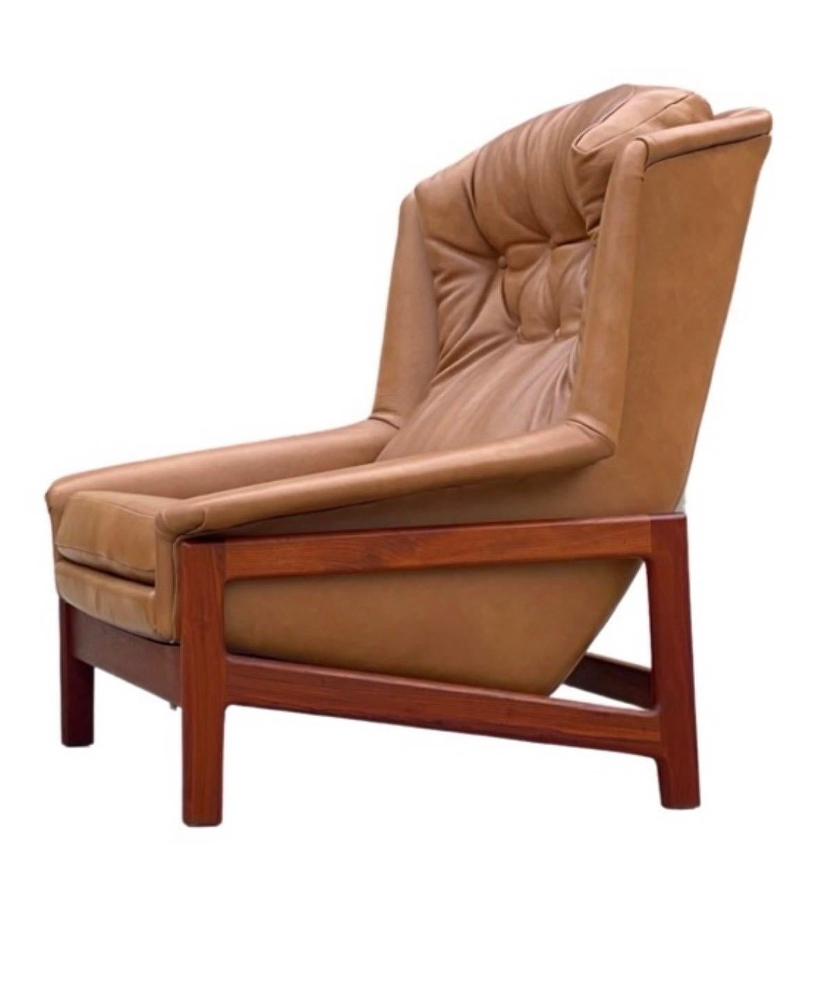 Unique on the market - oversized rocking and reclining lounge chair by Folke Ohlsson for DUX. Built in Sweden, circa 1968. This was the top of the line model that DUX offered - the chair rocks smoothly within its base and locks in 8 different