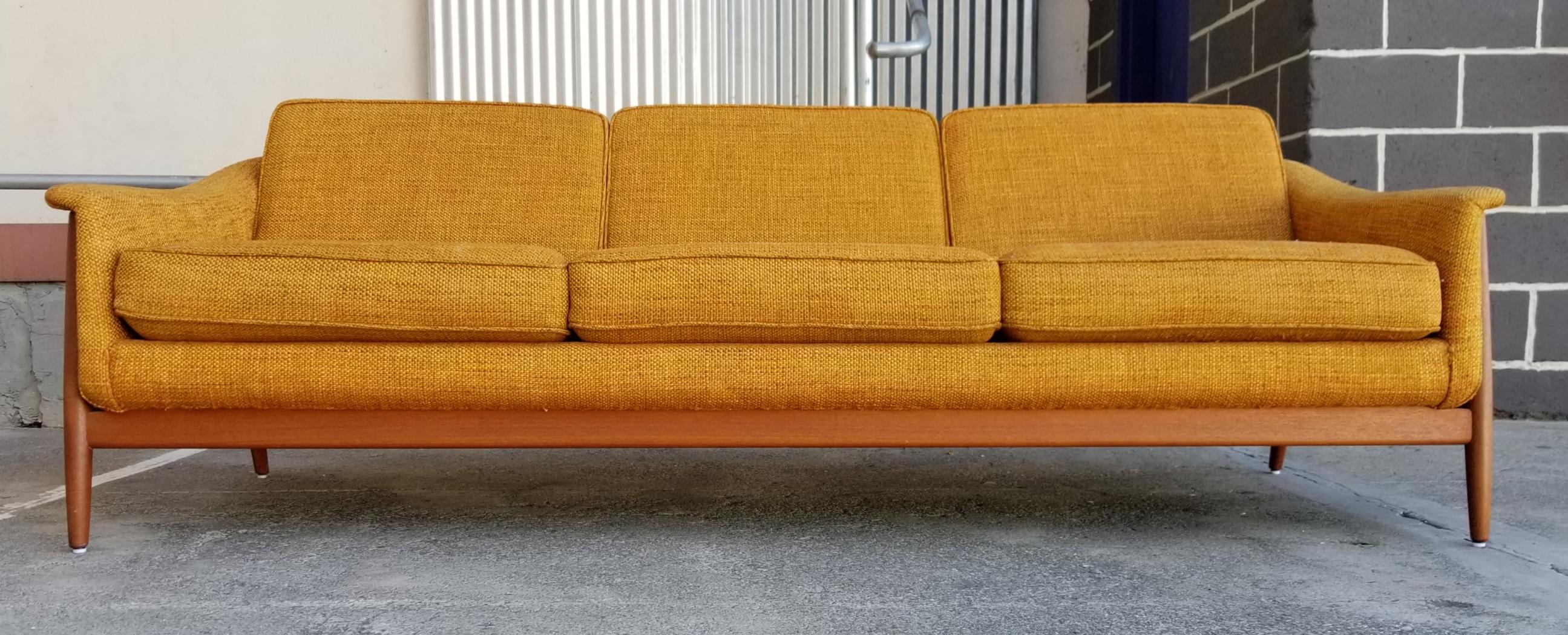 A very nice, original example of a 1960s teak Danish modern 3-seat sofa designed by Folke Ohlsson for DUX. Amazing original condition with original fabric. All 6 reversible cushions have new foam stuffing. Original finish to teak exoskeleton frame