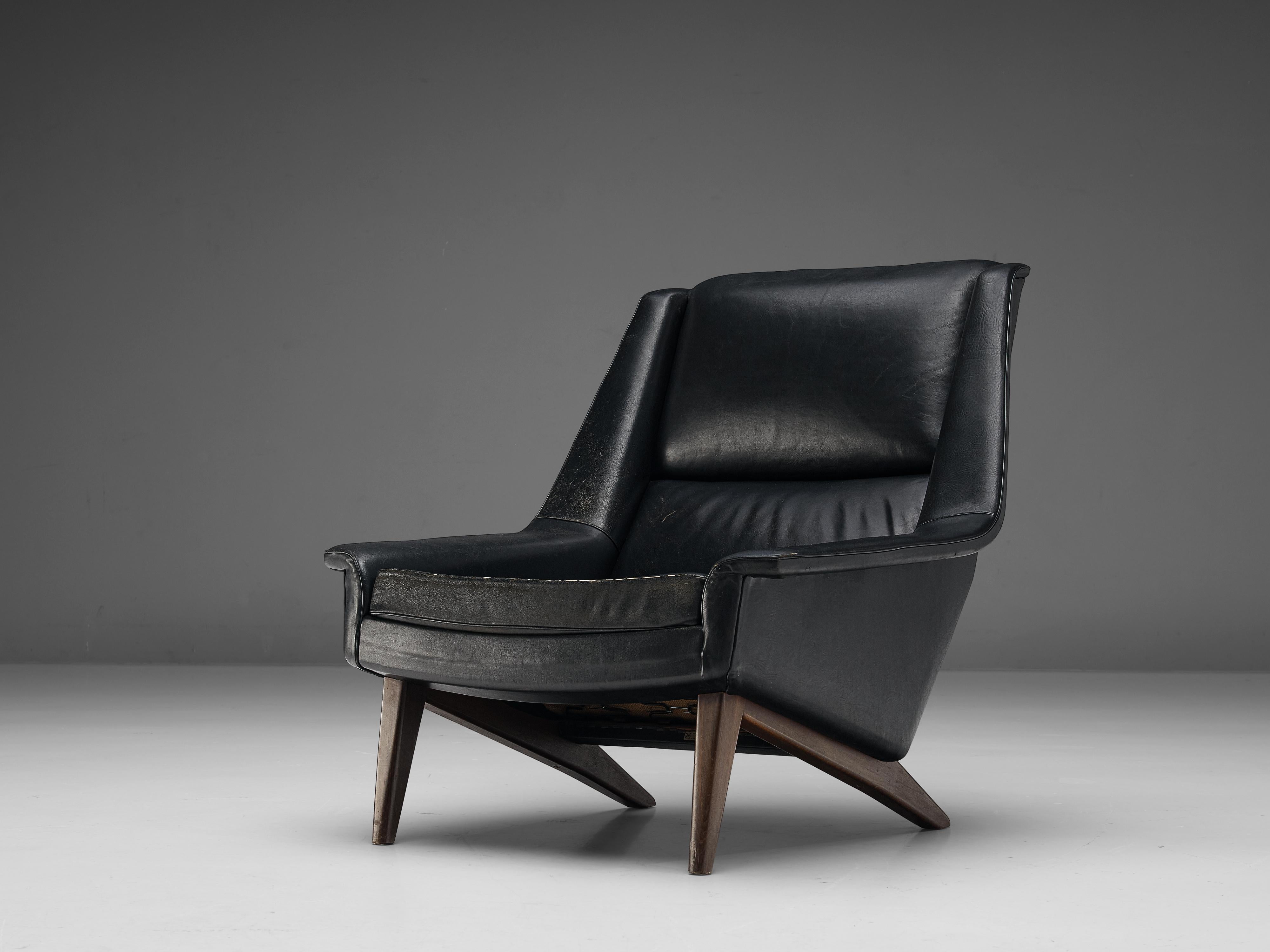 Folke Ohlsson for Fritz Hansen, lounge chair model ‘4410’, leather, beech, Denmark, design 1957

This high quality lounge chair is characterized by a stylish timeless design based on elegant shapes and clean lines. The slightly wing-shaped armrests