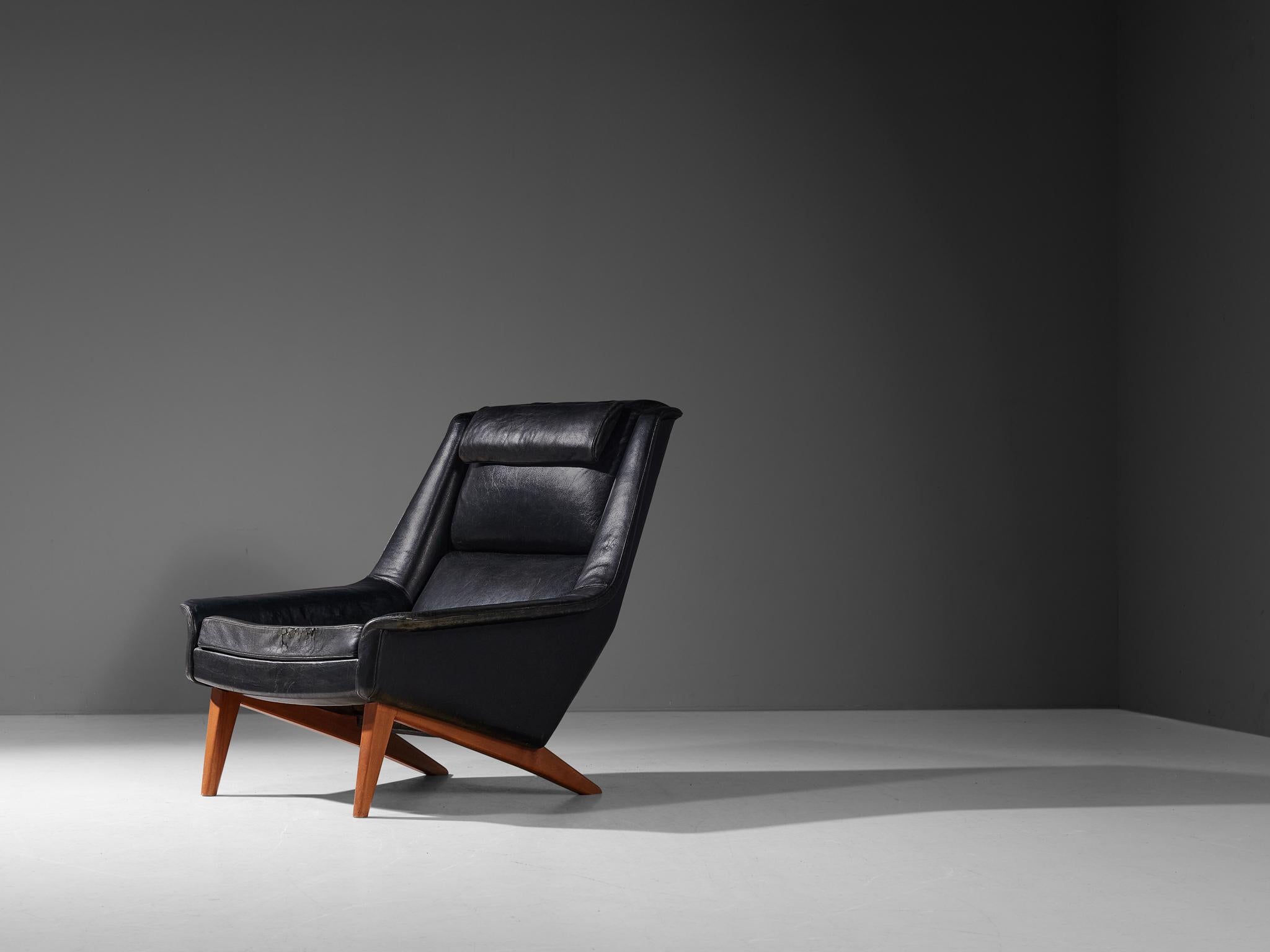 Folke Ohlsson for Fritz Hansen, easy chair model '4410', leather, beech, Denmark, designed in 1957

This high-quality lounge chair is characterized by a stylish timeless design based on elegant shapes and clean lines. The slightly wing-shaped