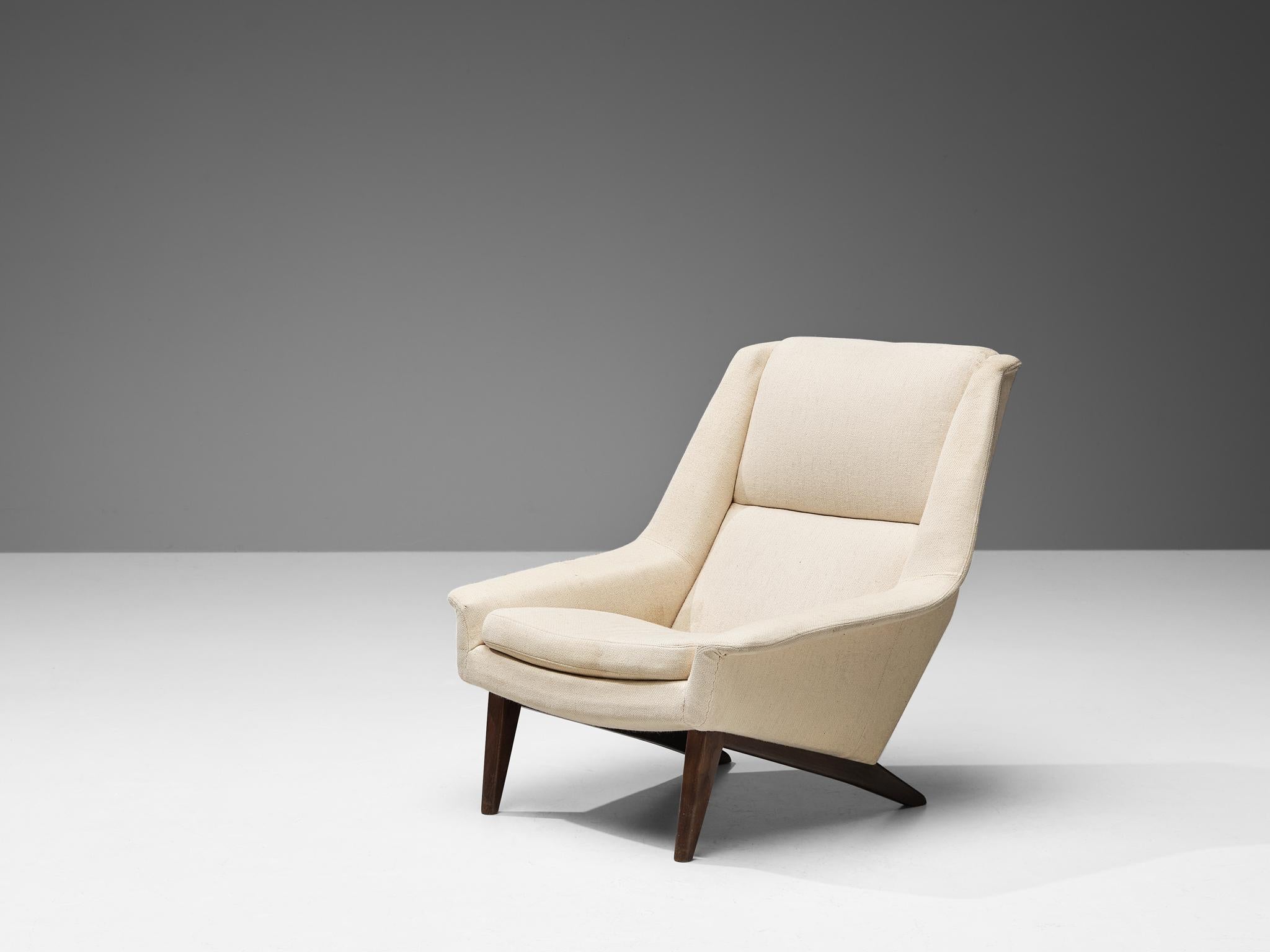 Folke Ohlsson for Fritz Hansen, lounge chair, model '4410', fabric, teak, Denmark, design in 1957

Armchair by Folke Ohlsson made in Denmark in the 1950s. This high quality lounge chair is characterized by a stylish timeless design based on elegant