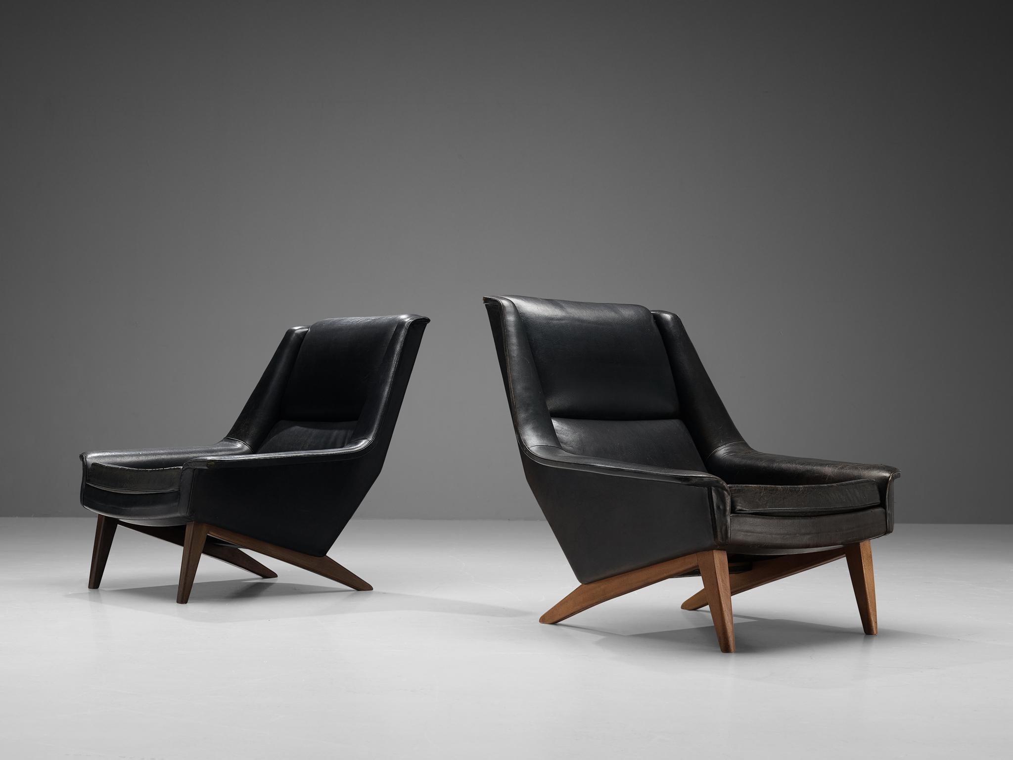 Folke Ohlsson for Fritz Hansen, easy chairs, model '4410', patinated leather, beech, Denmark, designed in 1957

These high quality lounge chairs are characterized by a stylish timeless design based on elegant shapes and clean lines. The slightly