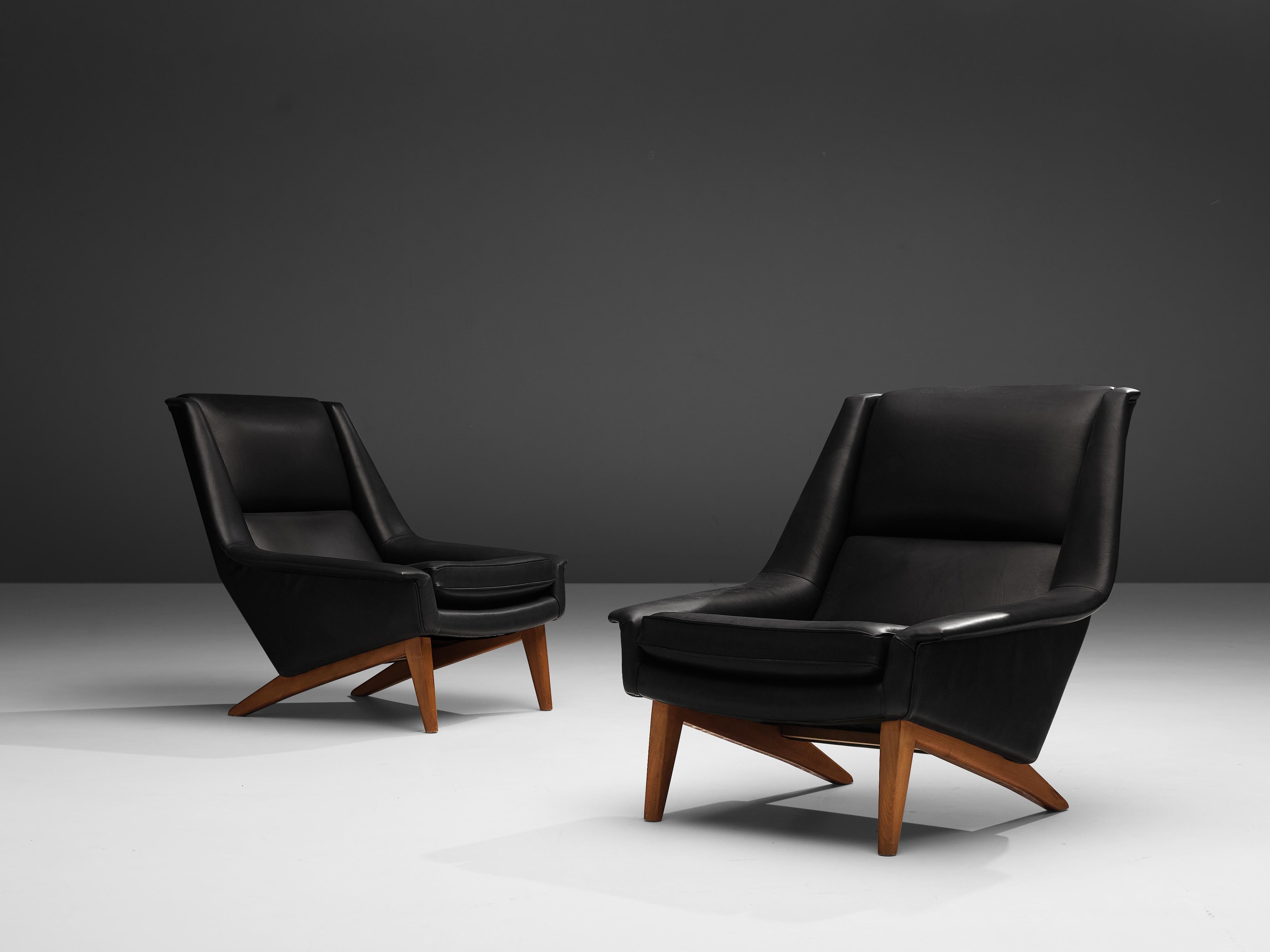 Folke Ohlsson for Fritz Hansen, reupholstered lounge chairs model 4410, black leather, teak, Denmark, design 1957

Beautiful reupholstered lounge chairs by Danish designer Folke Ohlsson designed in 1957. These two ‘4410’ lounge chairs have been