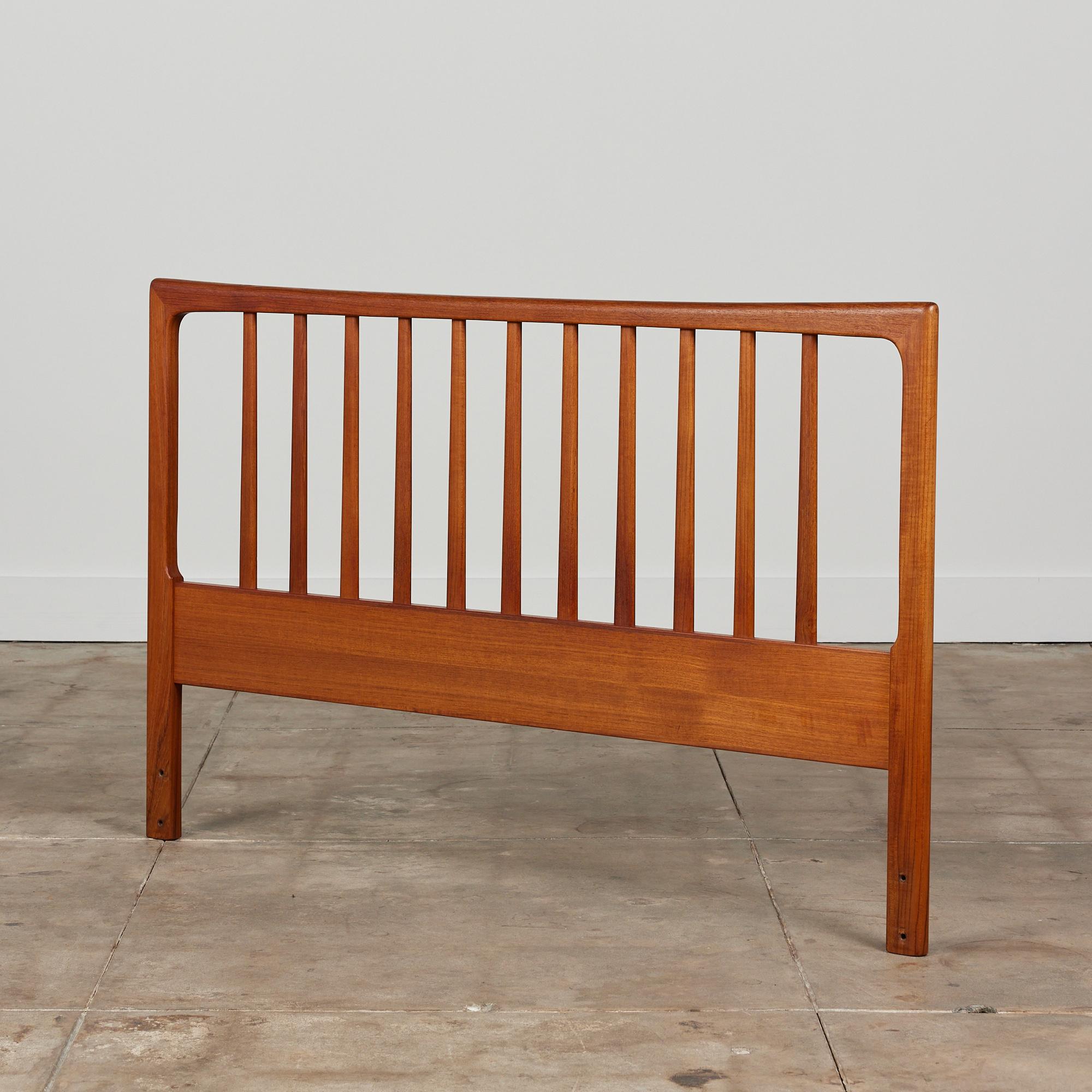 Teak headboard by Folke Ohlsson, circa.1960s for DUX of Sweden. This piece made from solid teak features a spindle detail and soft rounded corners.

Dimensions
54