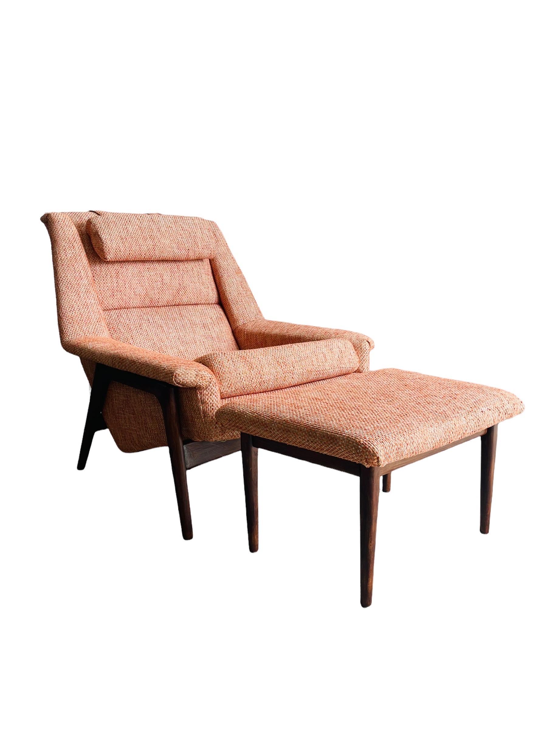 Stunning Mid-Century Modern Walnut lounge chair & ottoman designed by Folke Ohlsson for DUX Furniture. This chair & ottoman is newly reupholstered with orang/peachy tweet fabric. The chair is in good vintage condition. 

Measures: Chair: W 33.5” x