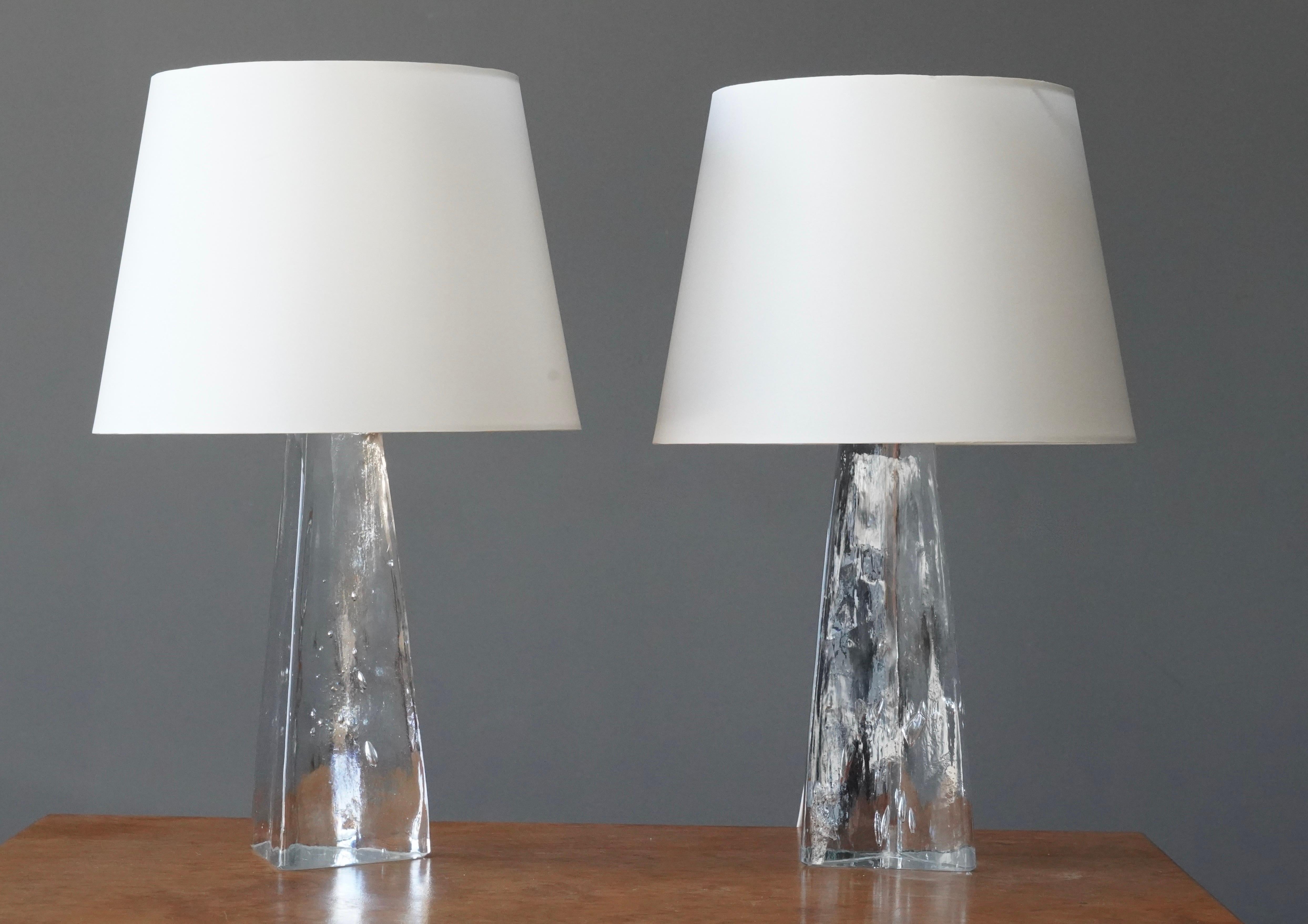 A pair of organic table lamps. Designed by Folke Walving for Målerås, Sweden, 1960s. Signed.

Dimensions listed are without shade. 
Dimensions with shade: height is 19.25 inches, width is 12 inches.
Dimensions of shade: top diameter is 9 inches,