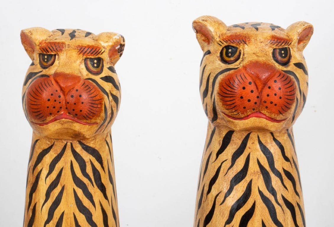 Pair of folkloric style polychrome decorated tiger sculptures, possibly southeast  Asian. 