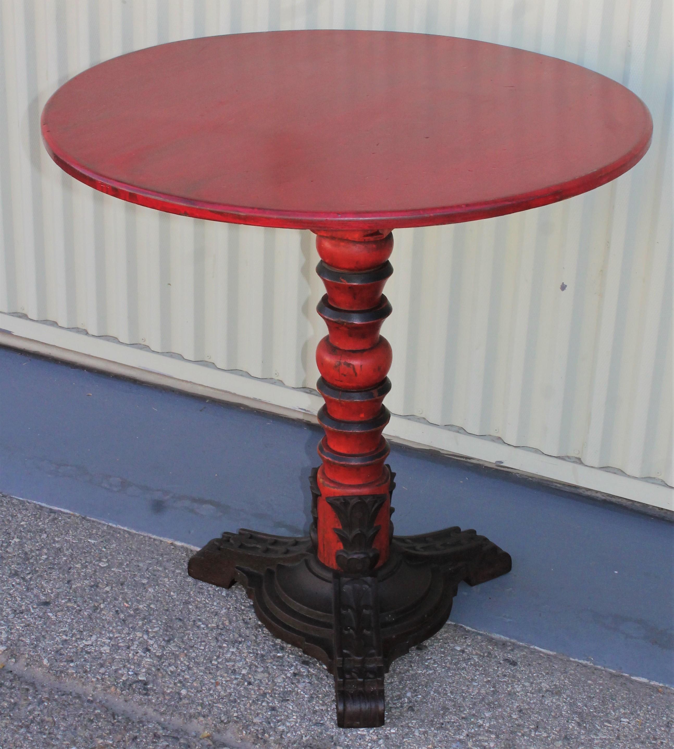 All original tomato red wood top and wood and iron base from the Old Chinese Theater in Los Angeles. This table has the original manufacturers plaque on the inside of the table. Looks great with modern or country furniture. 

The manufacturers