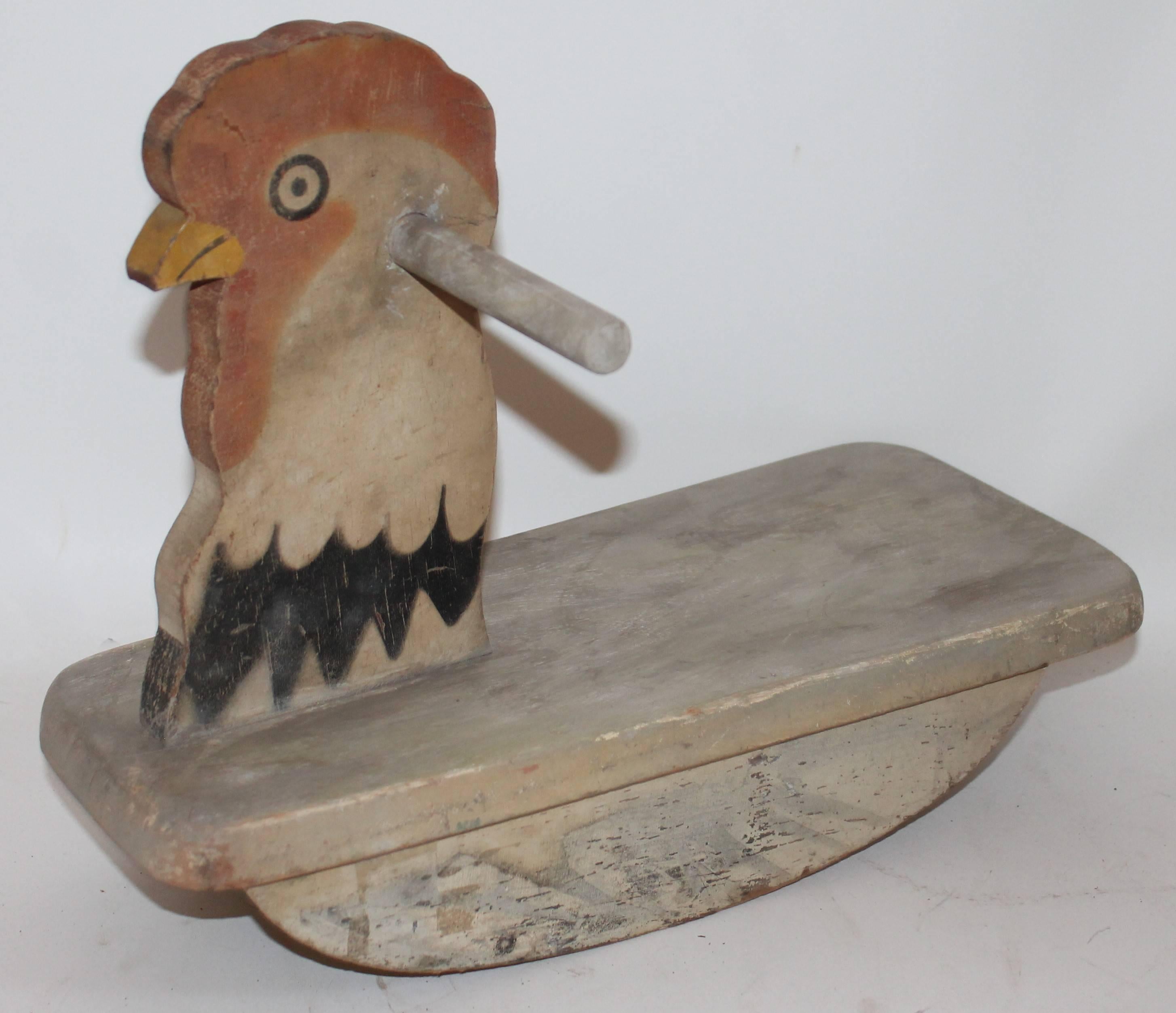 This original painted folky chicken rocker is in good condition. It is all original painted surface. Signed on base Toddler Toy's / Made by Gould Mft. Co. Oshkosh ,Wis.
