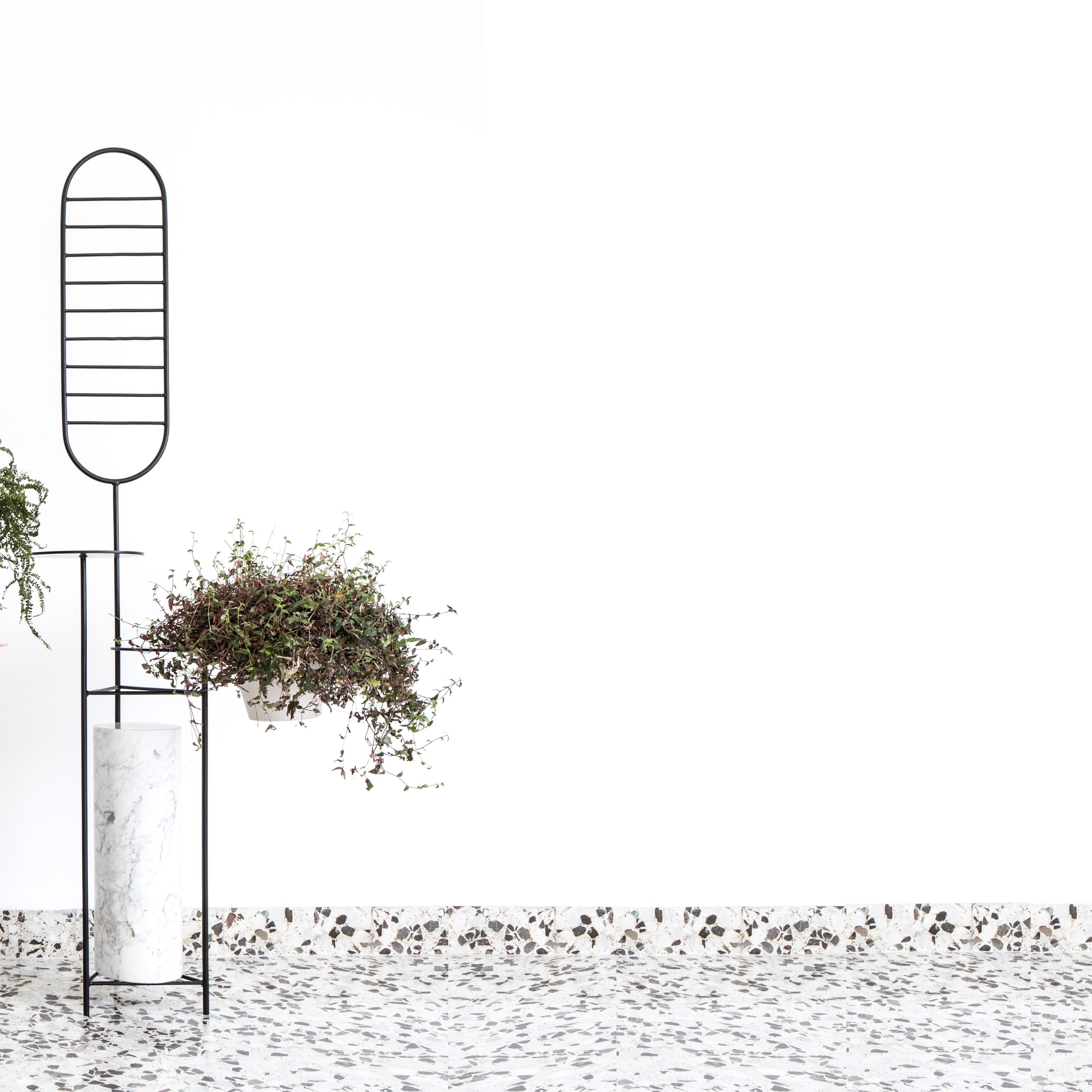 Folli black steel by Borgi Bastormagi
Dimensions: W 75 x D 70 x H 160 cm
Material: Steel, marble

Foll[i] offers a moment of one to one relation with nature. A minimal steel structure presents multiple possibilities for a personal garden at