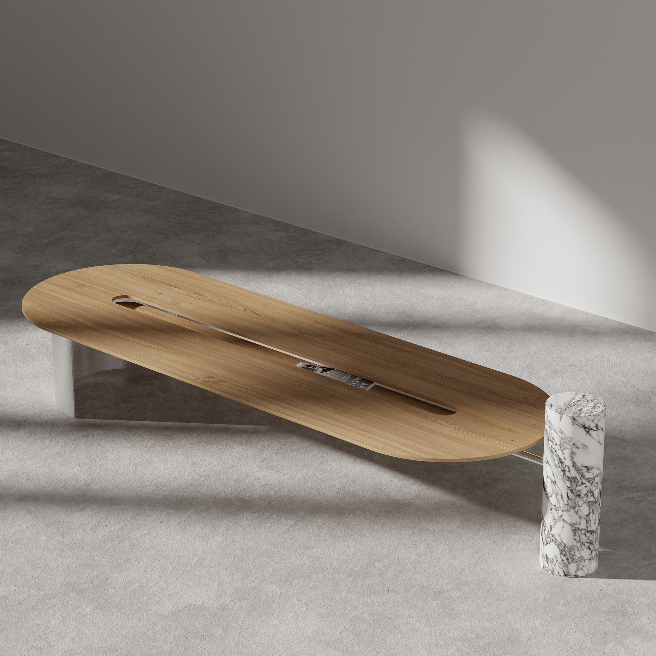 Folliland center table by Borgi Bastormagi
Dimensions: W 195 x D 60 x H 45 cm
Material: French oak, marble, steel

Oval shape wood table with a lower wood level in the center. Structurally it is balanced with a metal curved
structure (0.5cm