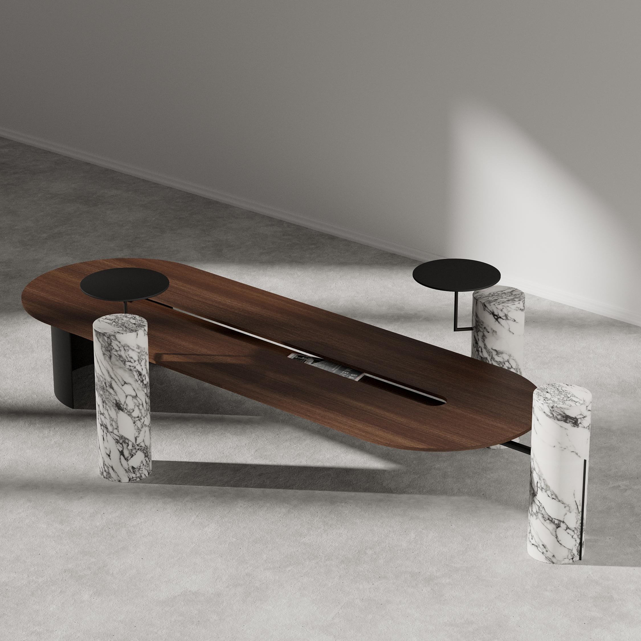 Folliland walnut center table by Borgi Bastormagi
Dimensions: W 195 x D 60 x H 45 cm
Material: Walnut Veneer, Marble, Steel

Oval shape wood table with a lower wood level in the center. Structurally it is balanced with a metal curved
structure
