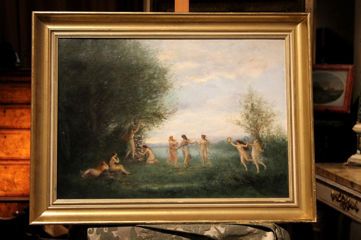 A luxuriant forest is the romantic and lyrical landscape where the dance of the nude nymphs takes place in this joyful 19th Century antique oil on canvas painting featuring a mythological scene.
Dance of the Nymphs and Naiads is a myth inspired by