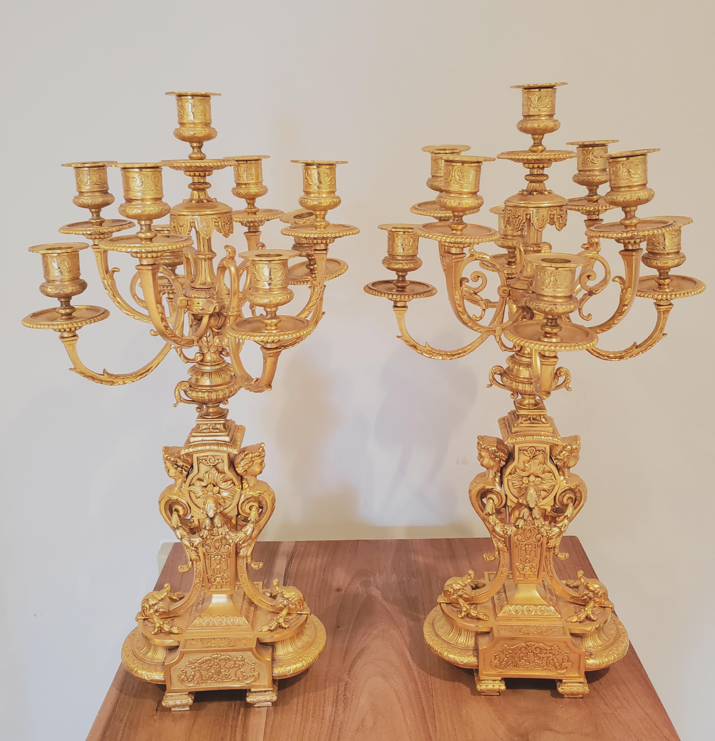 Fonderia Bronzi Artistici Italy (FBAI) 9-Candle candelabra in hand-cast bronze plated in 24k gold in very good condition. 
Measures 13 inches wide by 13 inches deep by 24 inches tall. These Candelabras are heavy and weight 42 pounds This is the