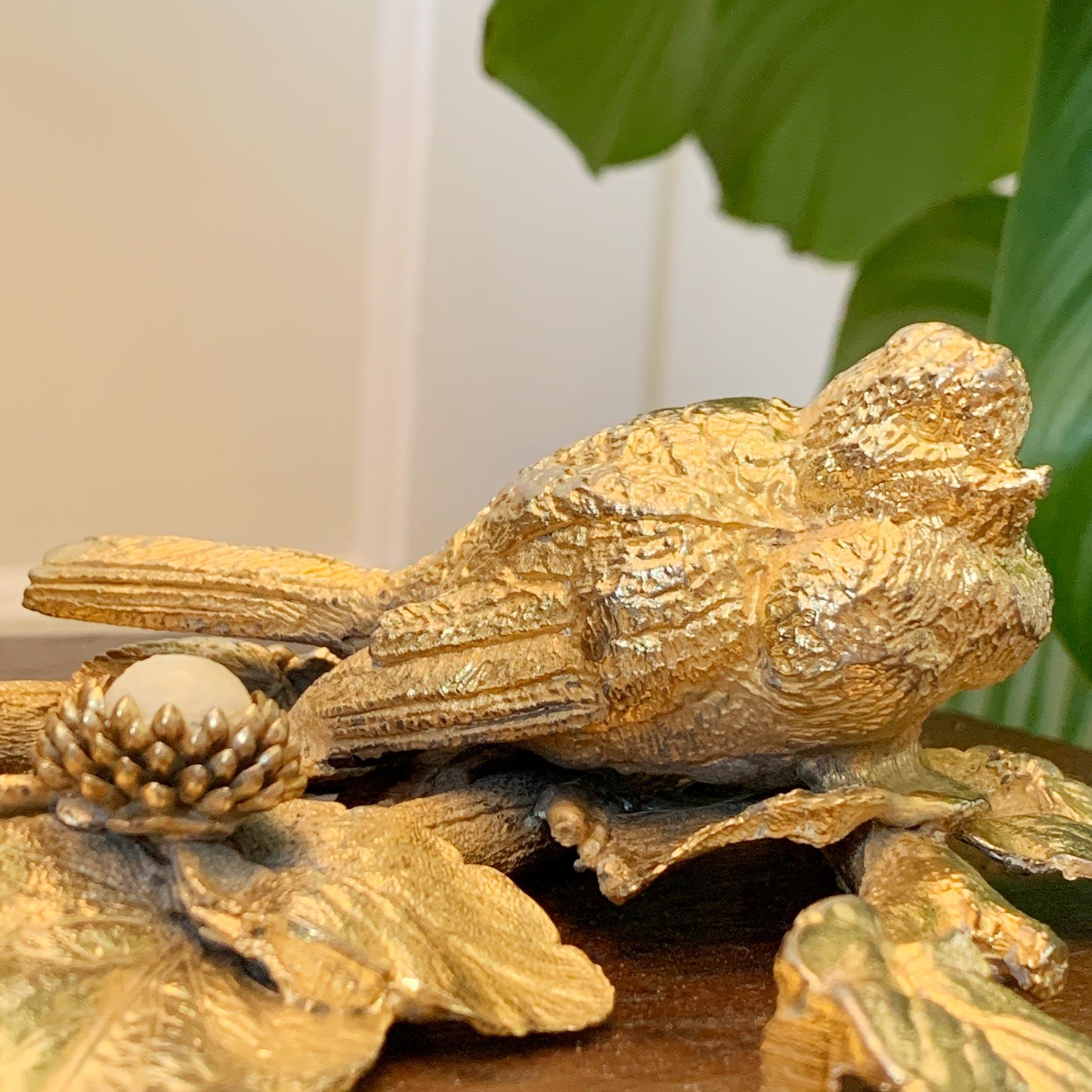 Bird & flowers table light, designed by Regis Dho for Fondica in Gisors, France, 1980's

This rare and pretty gilt plated bronze lamp depicts a small garden bird within leaves and flowers. The flowers are set with decorative cream centres and two
