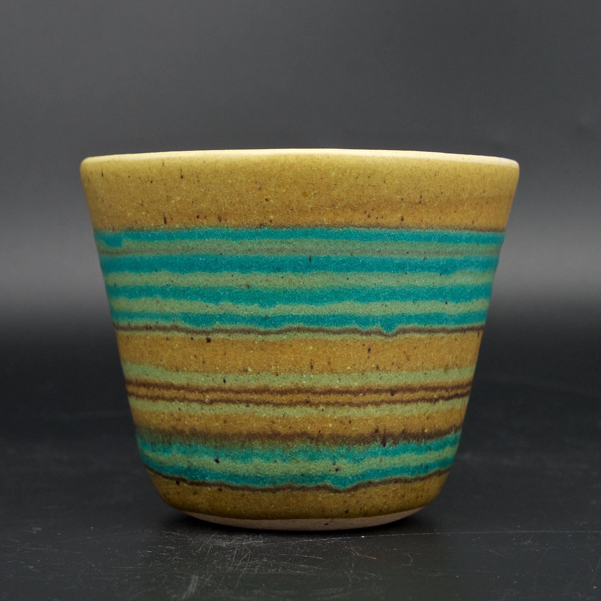 Small vase with wonderful layered glaze. Marked on base with incised 