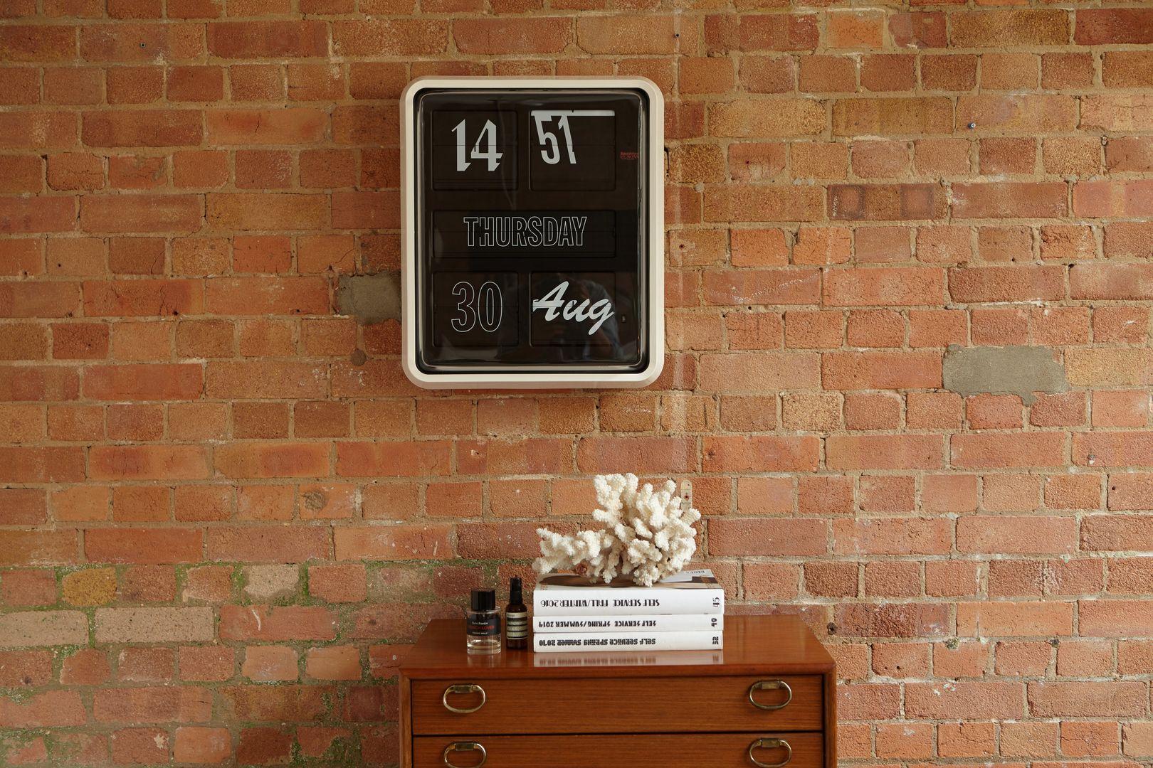 An instant design icon, Sebastian Wrong’s Font Clock features an ever-changing display that uses twelve different type faces and a flip mechanism in a design that is both nostalgic and contemporary.

The iconic calendar clock, with its distinctive