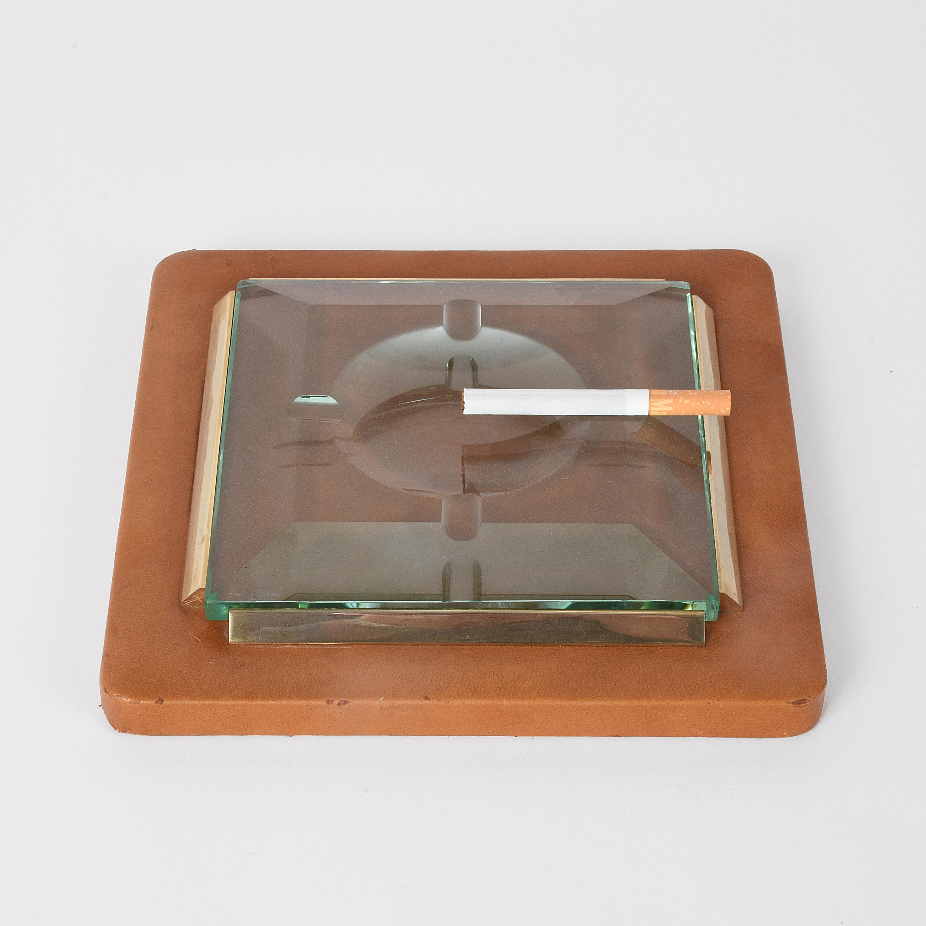 Fontana Arte 1970s. Ashtray in leather, brass and faceted glass.