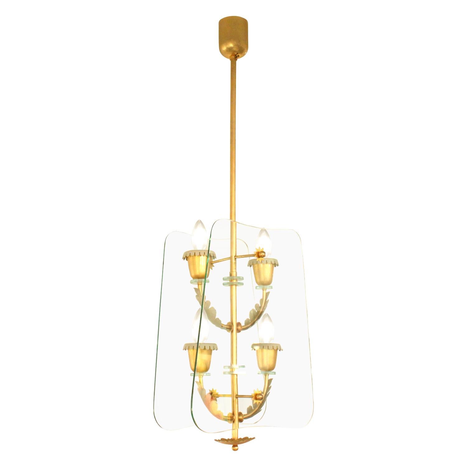 4-light pendant chandelier in brass and glass attributed to Pietro Chiesa for Fontana Arte, Italy, 1940s. This light is extremely elegant.