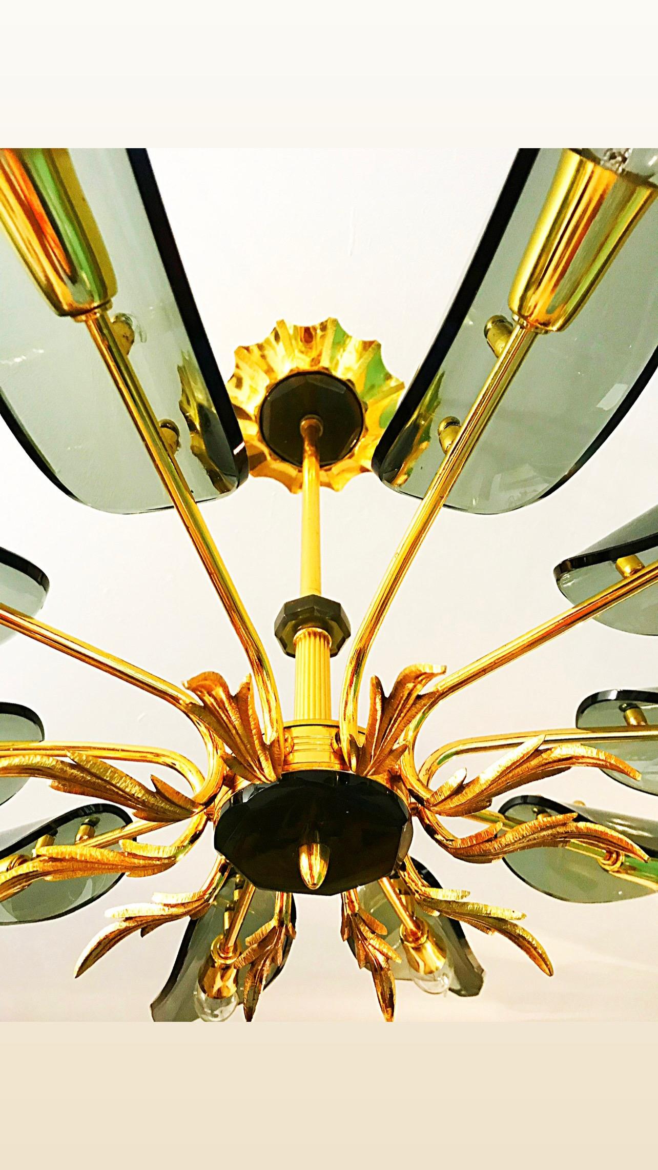 Superb chandelier with glass oversized 103 cm with gilt gold structure. The Design and the quality of the glass make this piece the best of the italian Design.

This Pieces of Arts glass show the exclusive design of Italian Designer in 1960/70. This