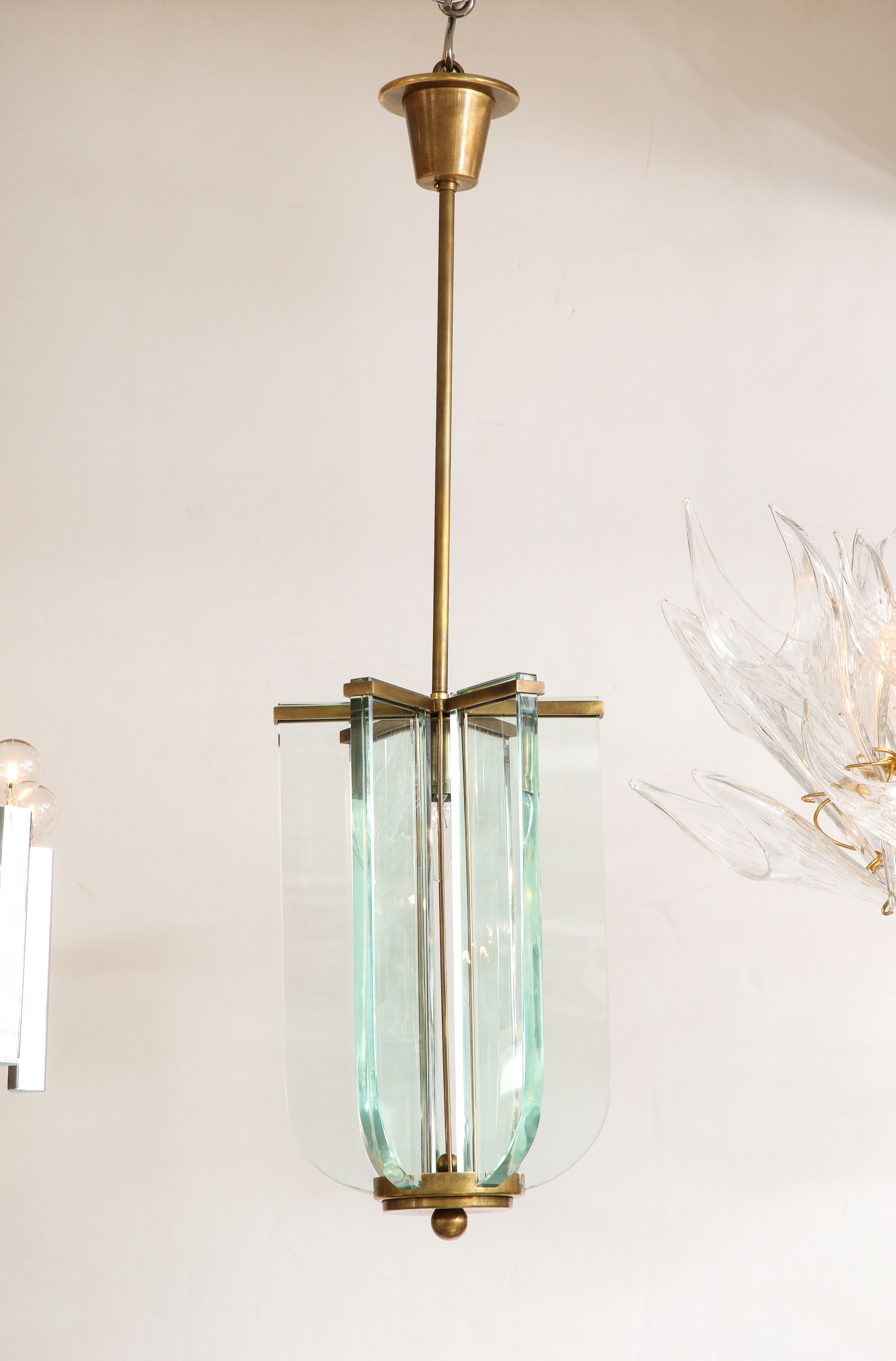 Beautiful 1950's solid brass and glass Italian pendant attributed to Fontana Arte, in vintage condition with minor wear and patina due to age and use, newly rewired and ready to use. 
