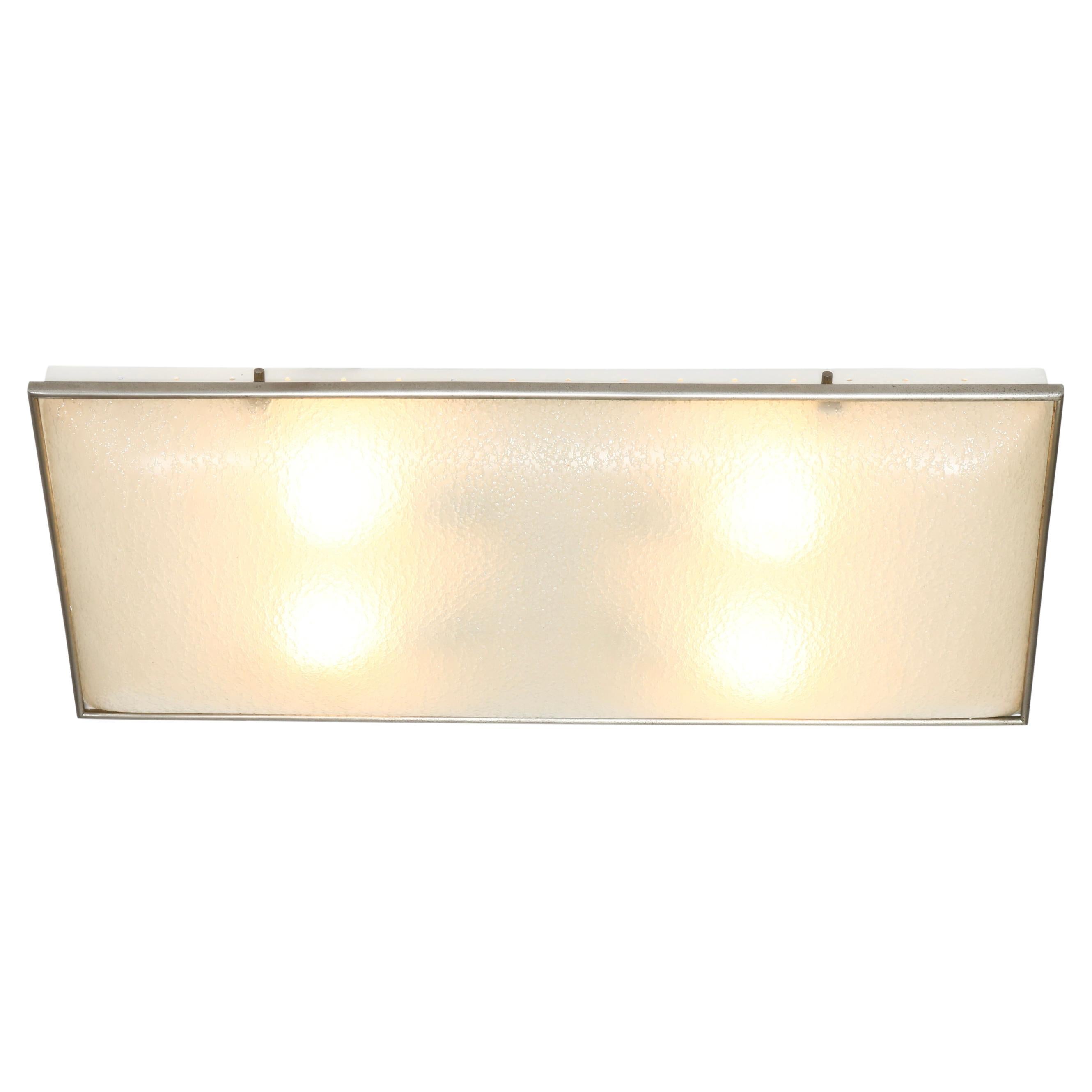 Fontana Arte attributed ceiling or wall light.
Textured glass, nickel plated metal, enameled metal.
Designed and manufactured in Italy, 1960s
Takes 4 medium base bulbs.
Rewired for US.

We take pride in bringing vintage fixtures to their full glory