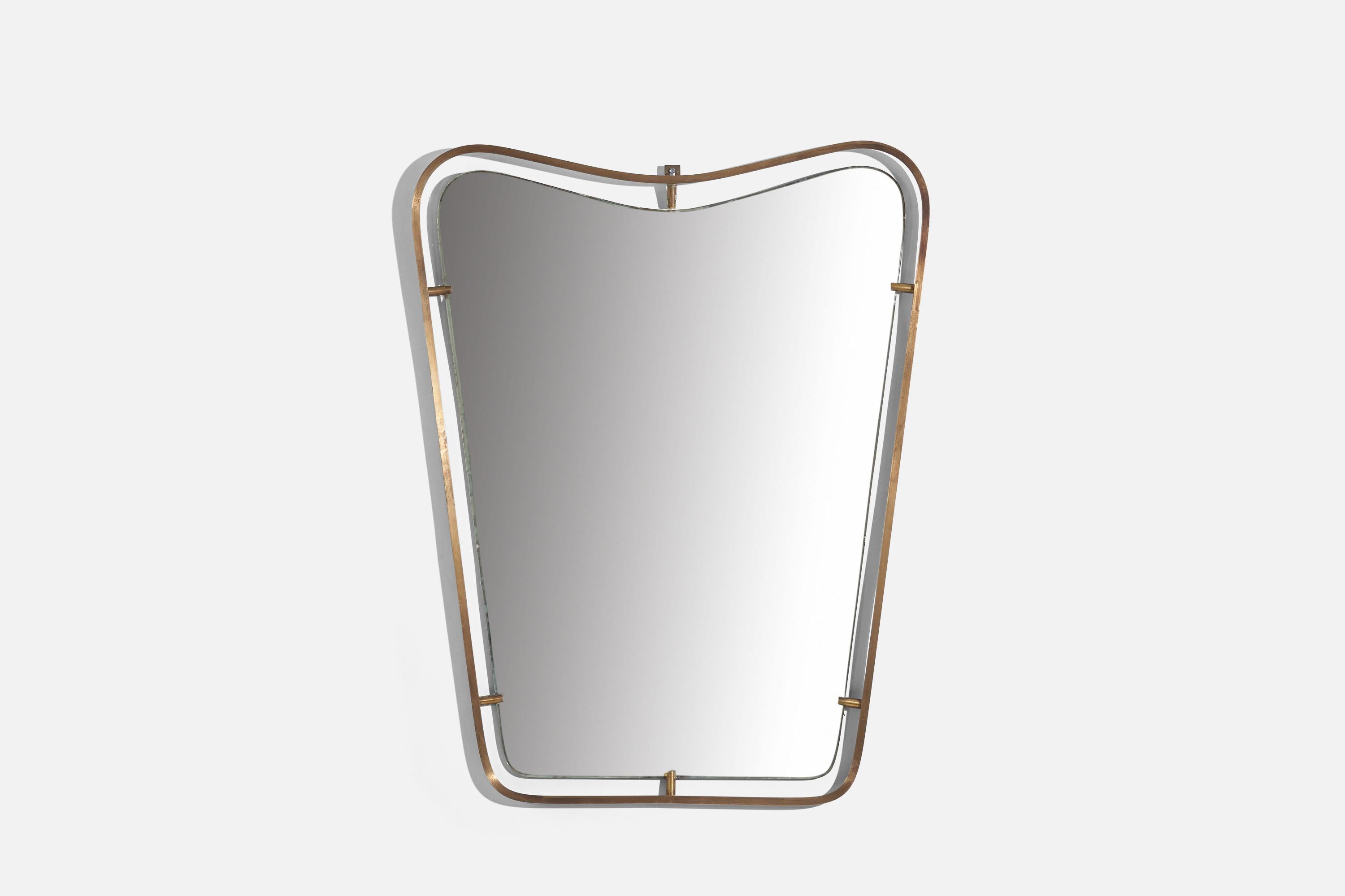 A brass wall mirror attributed to Fontana Arte, Italy, 1950s.