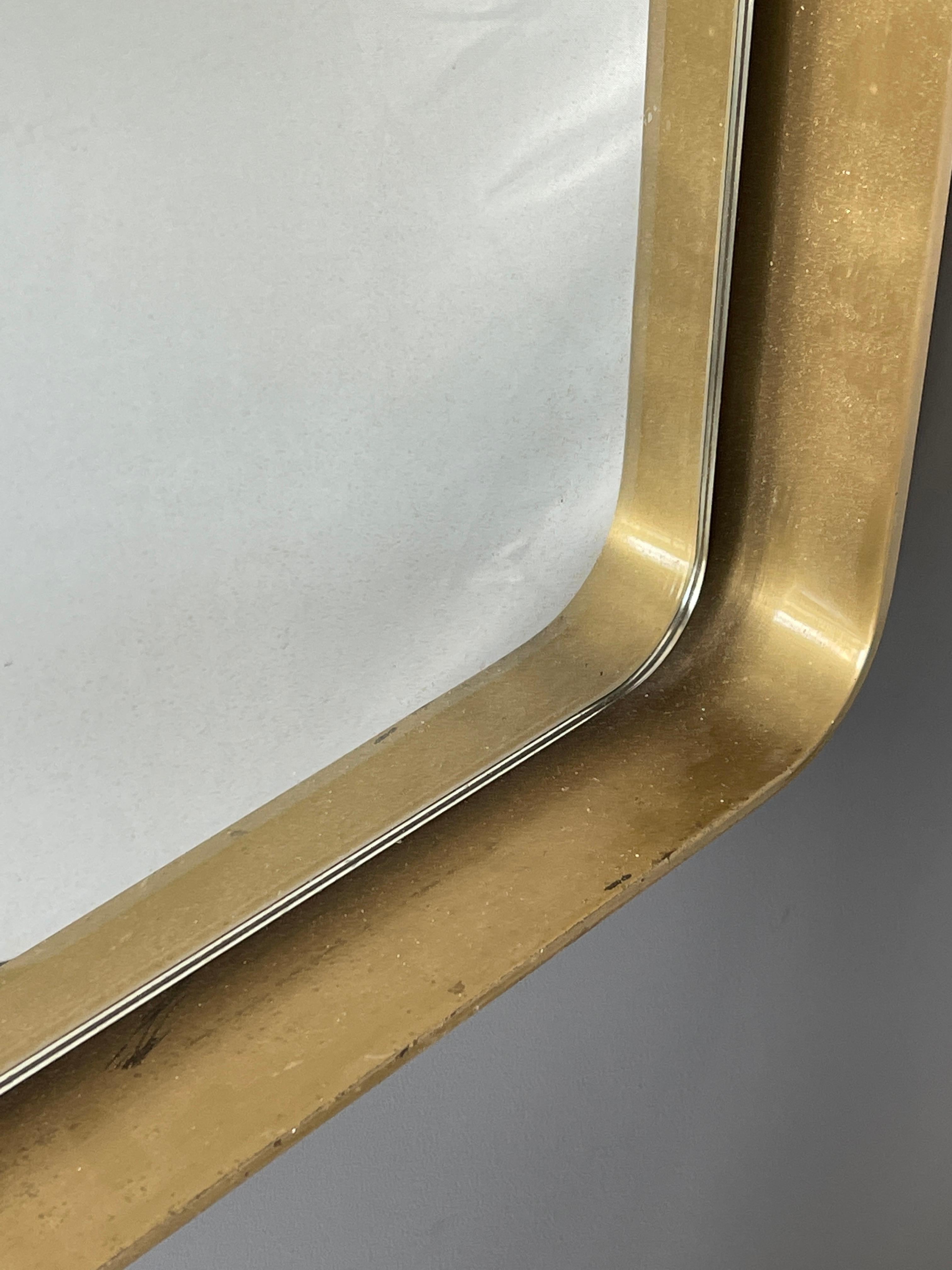A wall mirror, produced in Italy, 1950s. Cut mirror glass is framed in brass frame. Work sourced in Italy.

Other designers of the period include Gio Ponti, Fontana Arte, Paolo Buffa, Franco Albini, and Jean Royere.