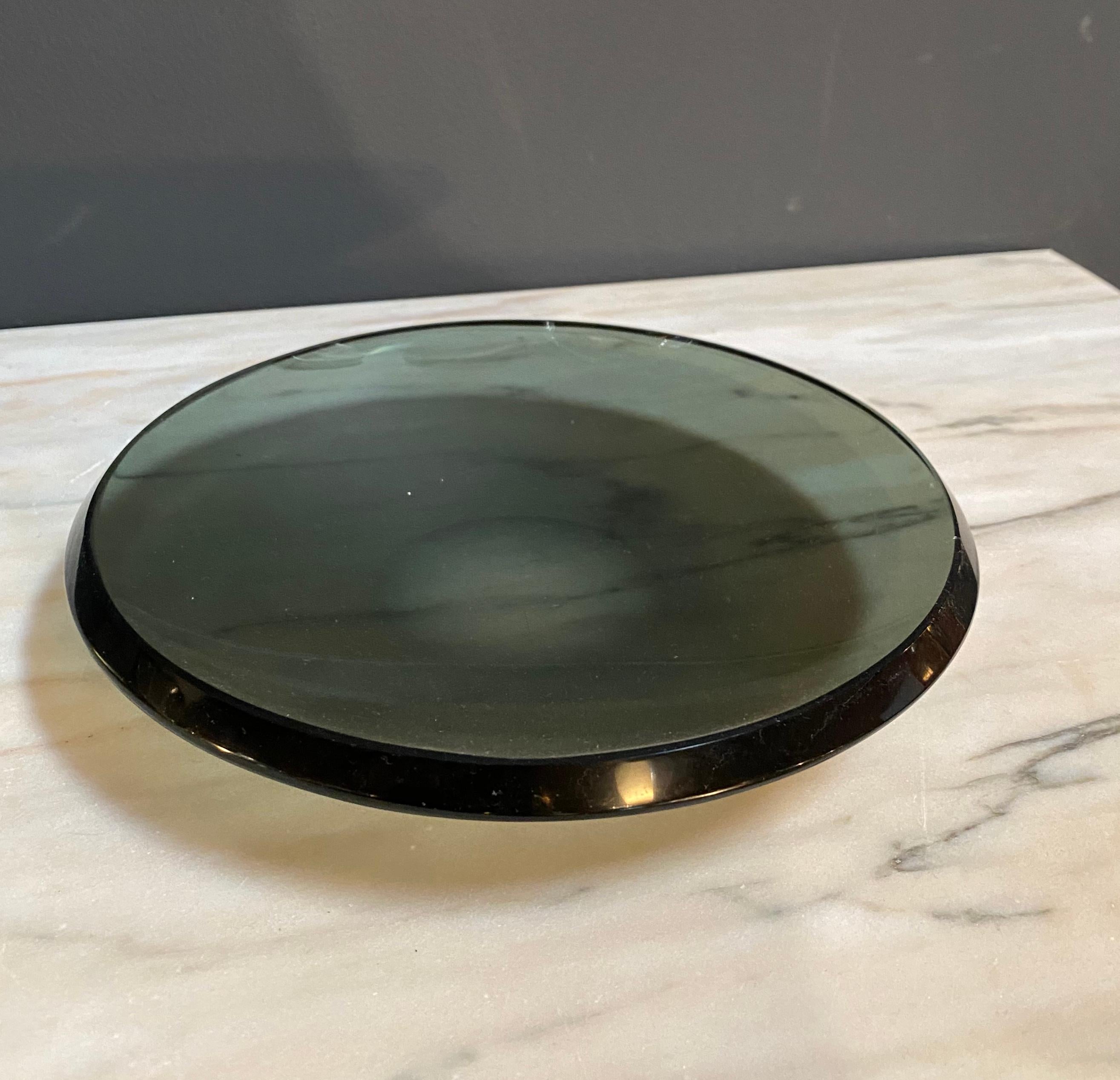 A bright black glass beveled edge glass dish or bowl by Fontana Arte signed FX on the edge as shown.
Model 2007 A, circa 1960.
Literature Quaderno Fontana Arte no 3, 1961 p.18.