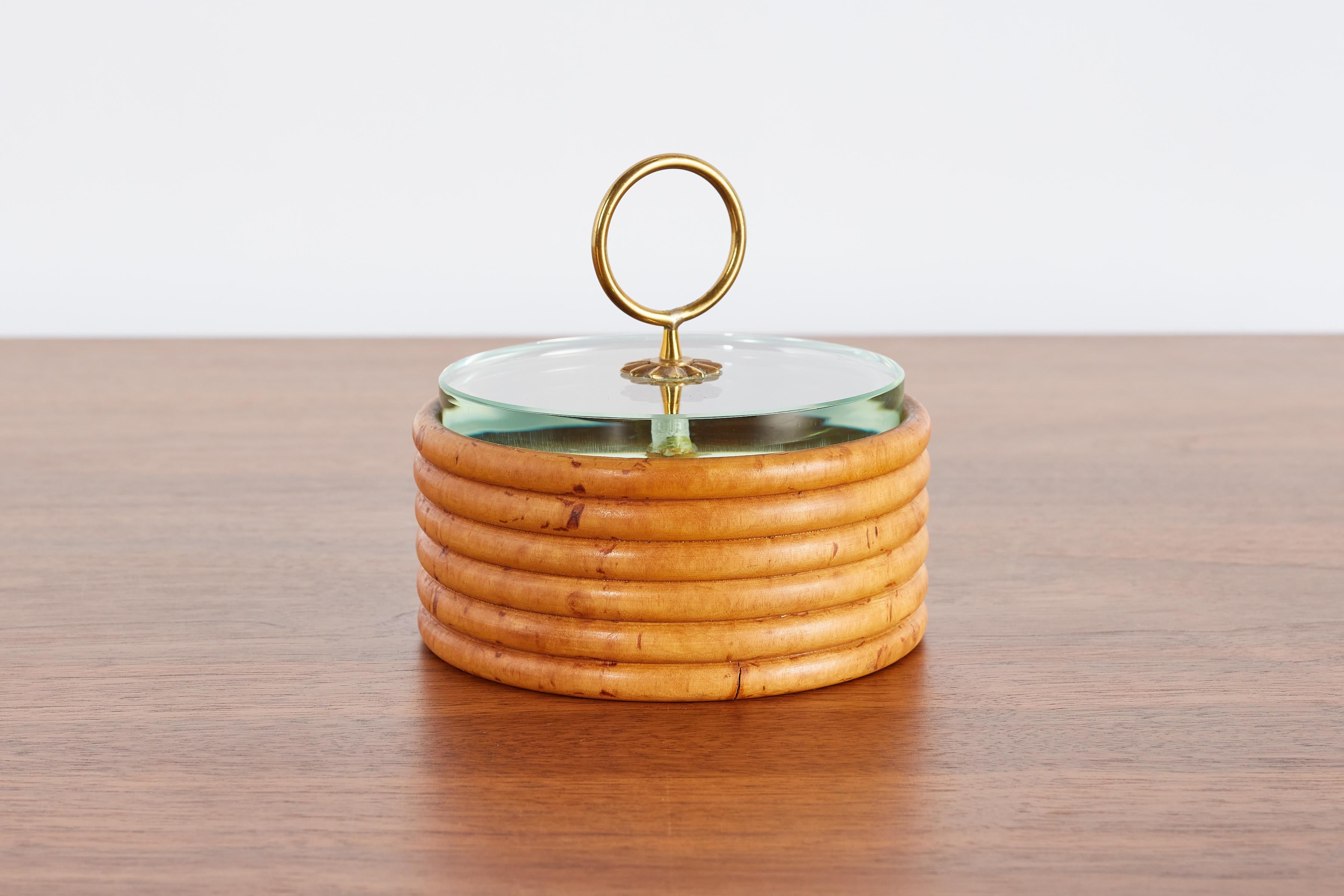 Rare Fontana Arte decorative box made in Italy circa 1960s. 

Ribbed wooden circular box with cut crystal lid and decorative brass handle. 

Thick aquamarine glass cover, finished with a brass handle.

Ribbed wooden structure with cut crystal lid