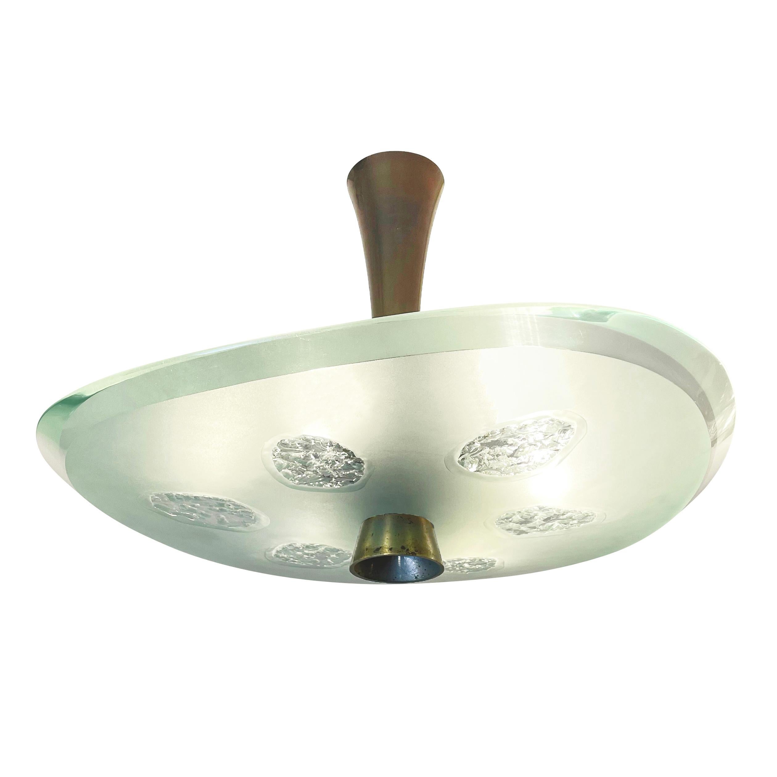 Fontana Arte ceiling light model 1748 designed by Max Ingrand in the 1950s. Features a beautiful thick glass shade with beveled edges which has been chiseled in six irregular areas. Holds six candelabra bulbs. 

Condition: Excellent vintage