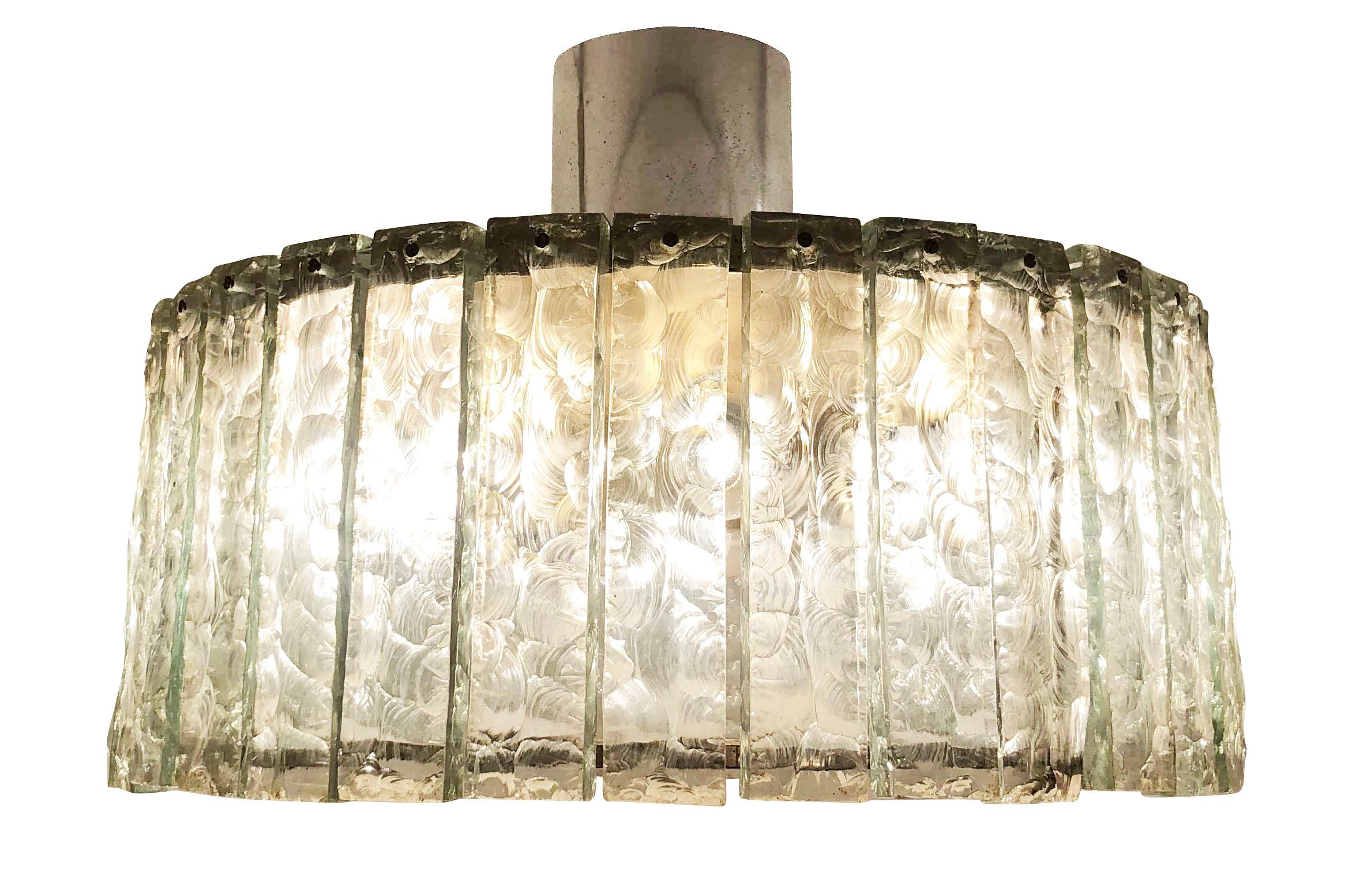 Fontana Arte ceiling light model 2448 designed by Max Ingrand in the 1960s. Features a nickel plated structure holding dozens of chiseled glasses. Closed at the bottom by a frosted glass diffuser. Holds eight candelabra sockets and one Edison